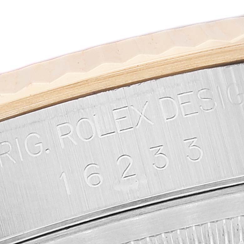 This is a close-up shot of the side case of the Rolex Datejust 16233 Men's Steel and Gold (two tone) White Dial 16233 Men's Steel and Gold (two tone) White Dial, showing the model number engraving.