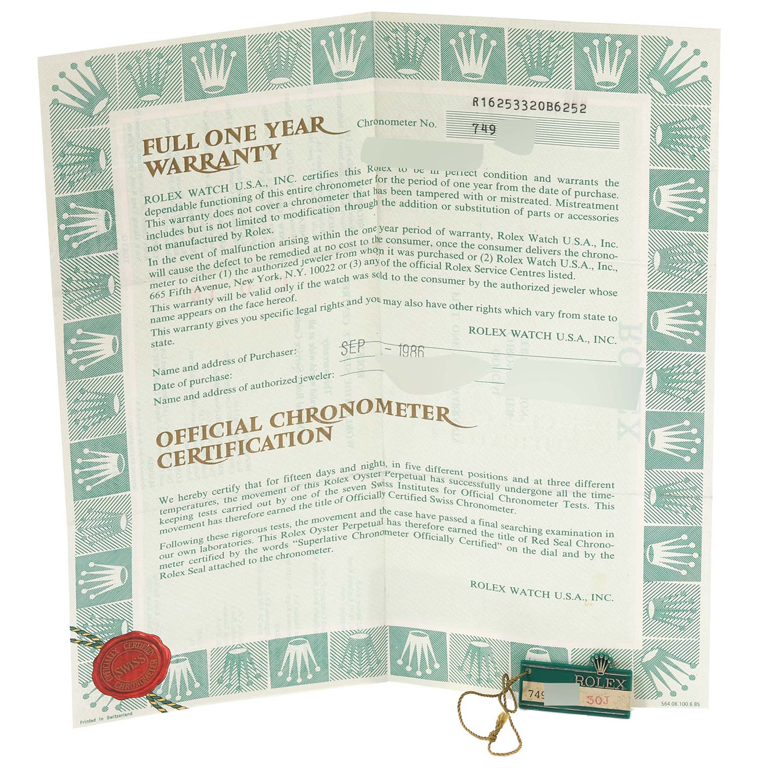 This image shows a full one-year warranty and official chronometer certification for a Vintage Collection Rolex watch.