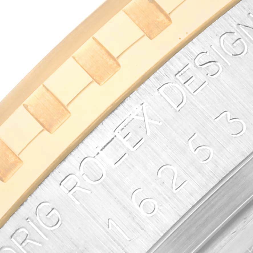 This image shows a close-up of the side engraving and bezel of a Rolex Vintage Collection 16253 Men's Steel and Gold (two tone) Champagne Dial 16253 Men's Steel and Gold (two tone) Champagne Dial watch.