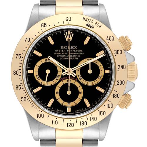 The Rolex Daytona 16523 Men's Steel and Gold (two tone) Black Dial watch is shown from a front angle, highlighting the dial, bezel, crown, and pushers.