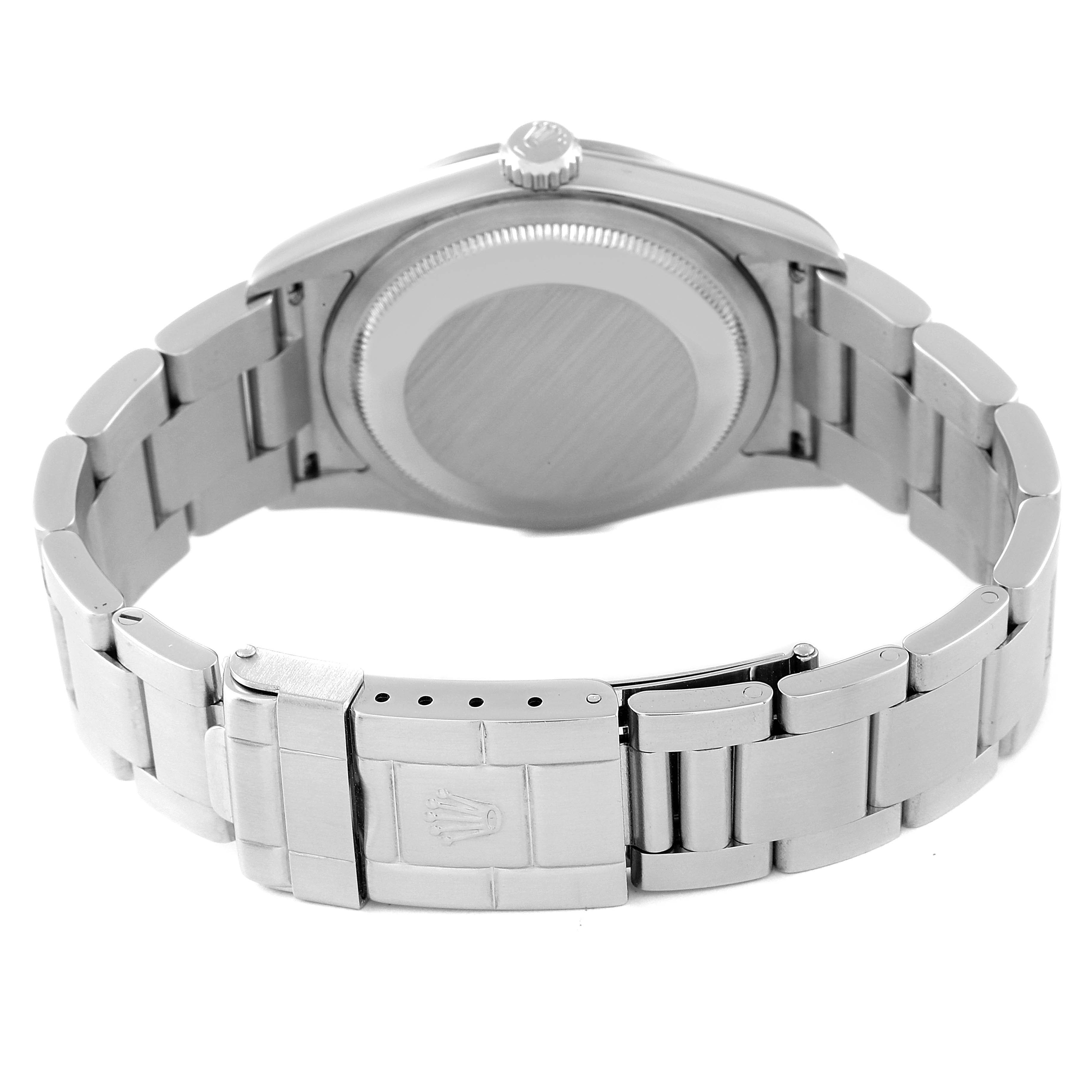 The image shows the back view of a Rolex Explorer 114270 Men
s Stainless Steel Black Dial 114270 Men
s Stainless Steel Black Dial watch, highlighting the case back, crown, and clasp on the bracelet.