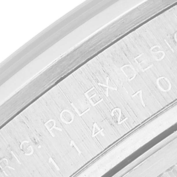 This image shows a close-up view of the engraved bezel on a Rolex Explorer 114270 Men
s Stainless Steel Black Dial 114270 Men
s Stainless Steel Black Dial watch.