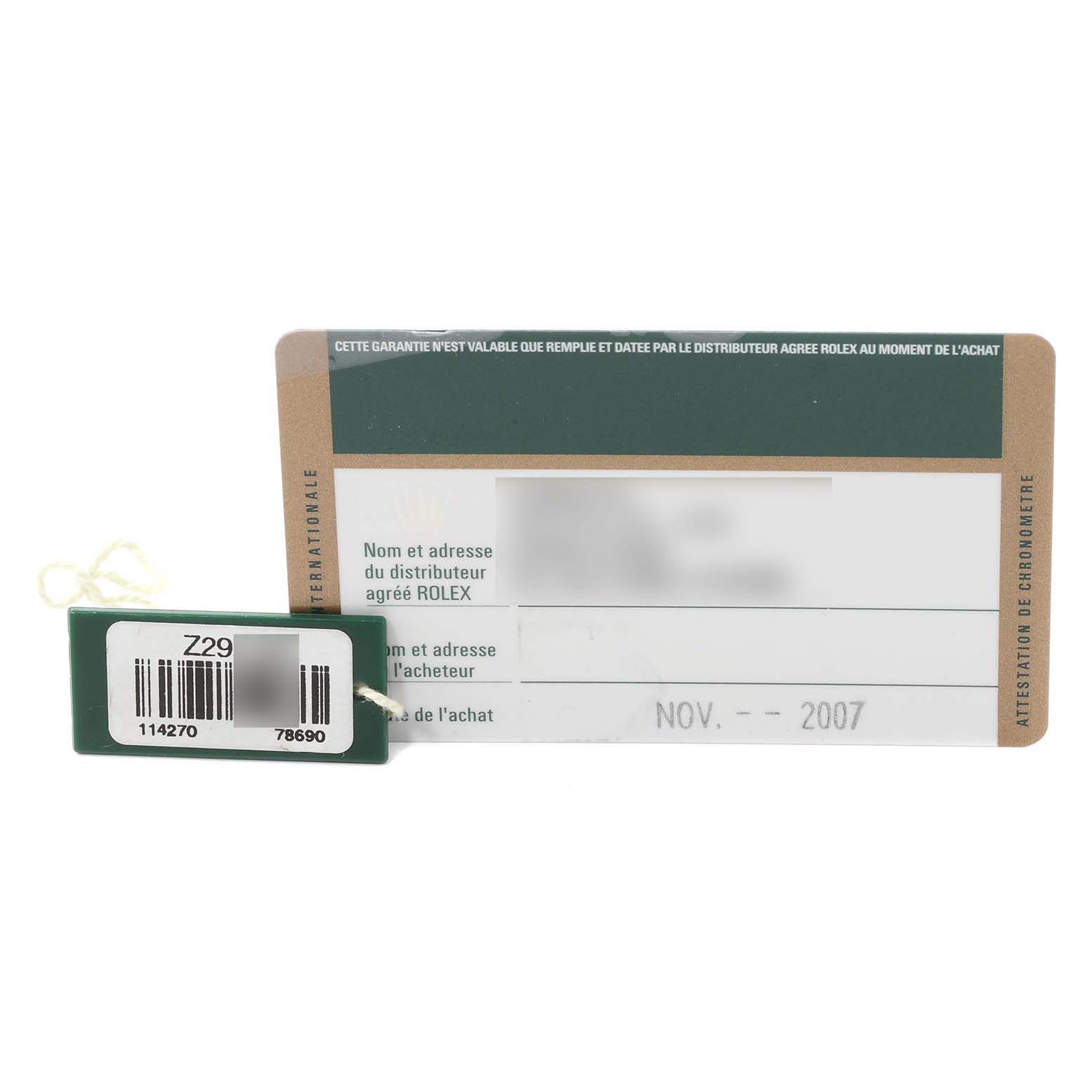 The image shows a warranty card and a tag for a Rolex Explorer 114270 Men
s Stainless Steel Black Dial 114270 Men
s Stainless Steel Black Dial model watch, dated November 2007.