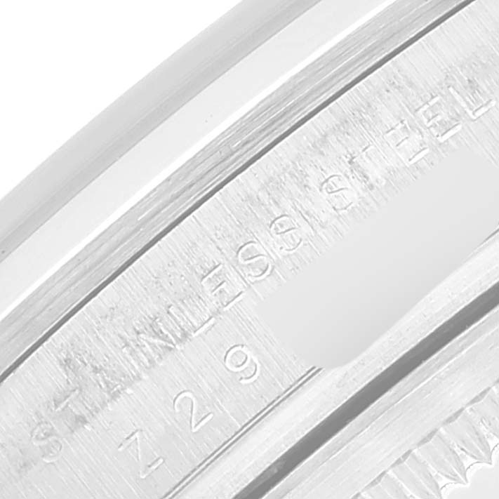 This image shows a close-up of the engraved case back of a Rolex Explorer 114270 Men
s Stainless Steel Black Dial 114270 Men
s Stainless Steel Black Dial watch, highlighting the "STAINLESS STEEL" text.
