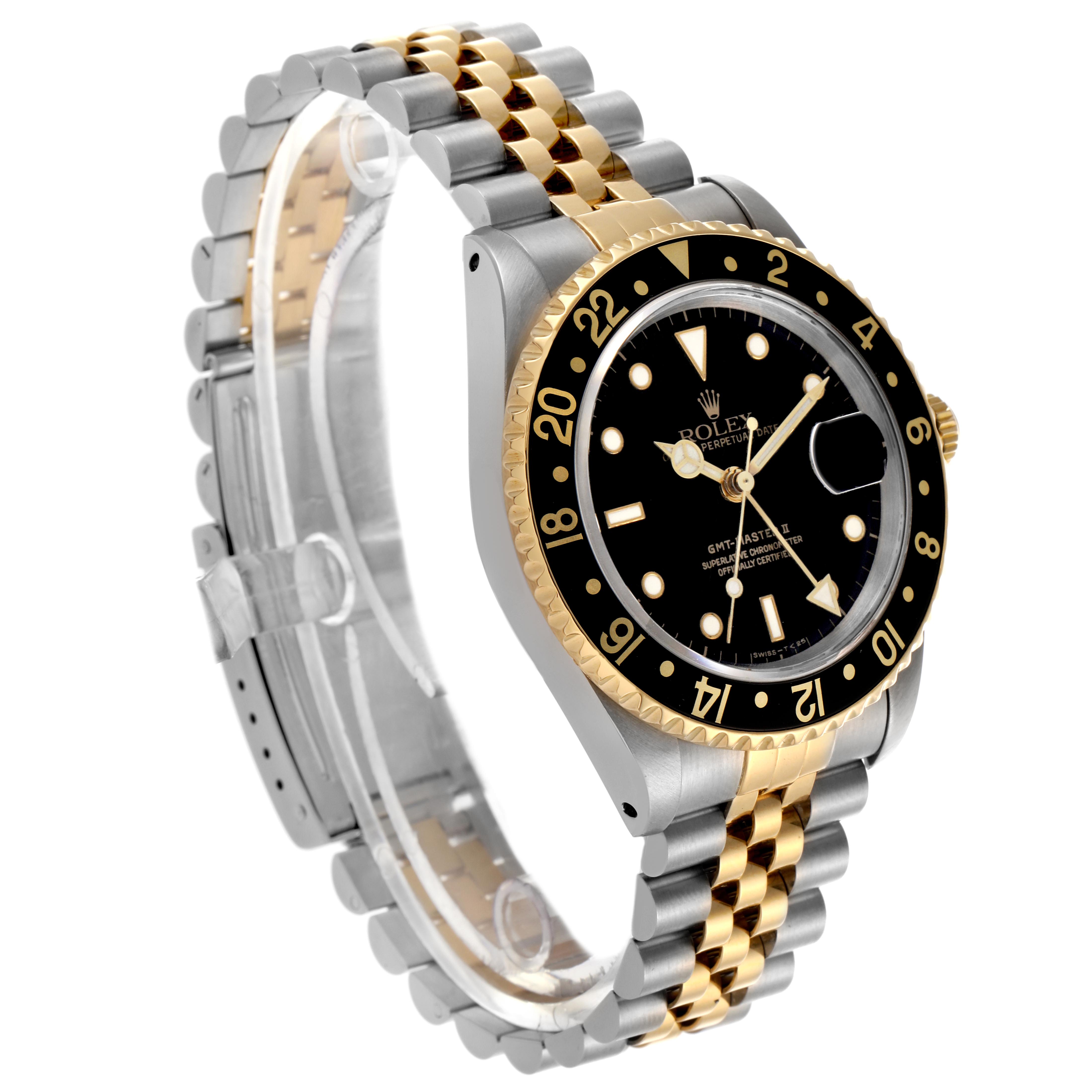 The Rolex GMT-Master 16713LN Men's Steel and Gold (two tone) Black Dial 16713LN Men's Steel and Gold (two tone) Black Dial watch is shown at a slight angle, displaying its bezel, dial, crown, and two-tone bracelet.