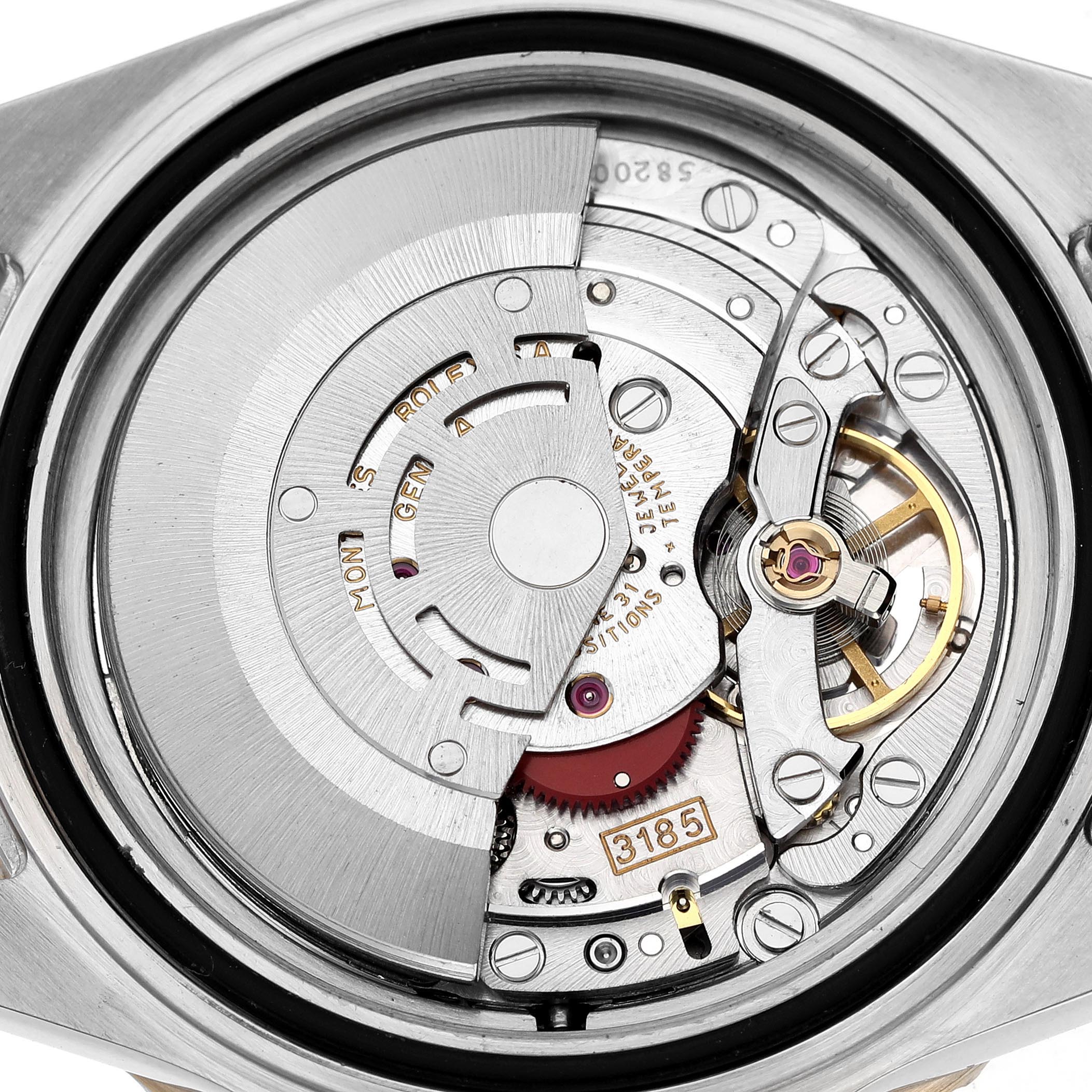 The image shows the internal mechanism of a Rolex GMT-Master 16713LN Men's Steel and Gold (two tone) Black Dial 16713LN Men's Steel and Gold (two tone) Black Dial watch, focusing on its intricate movement parts.