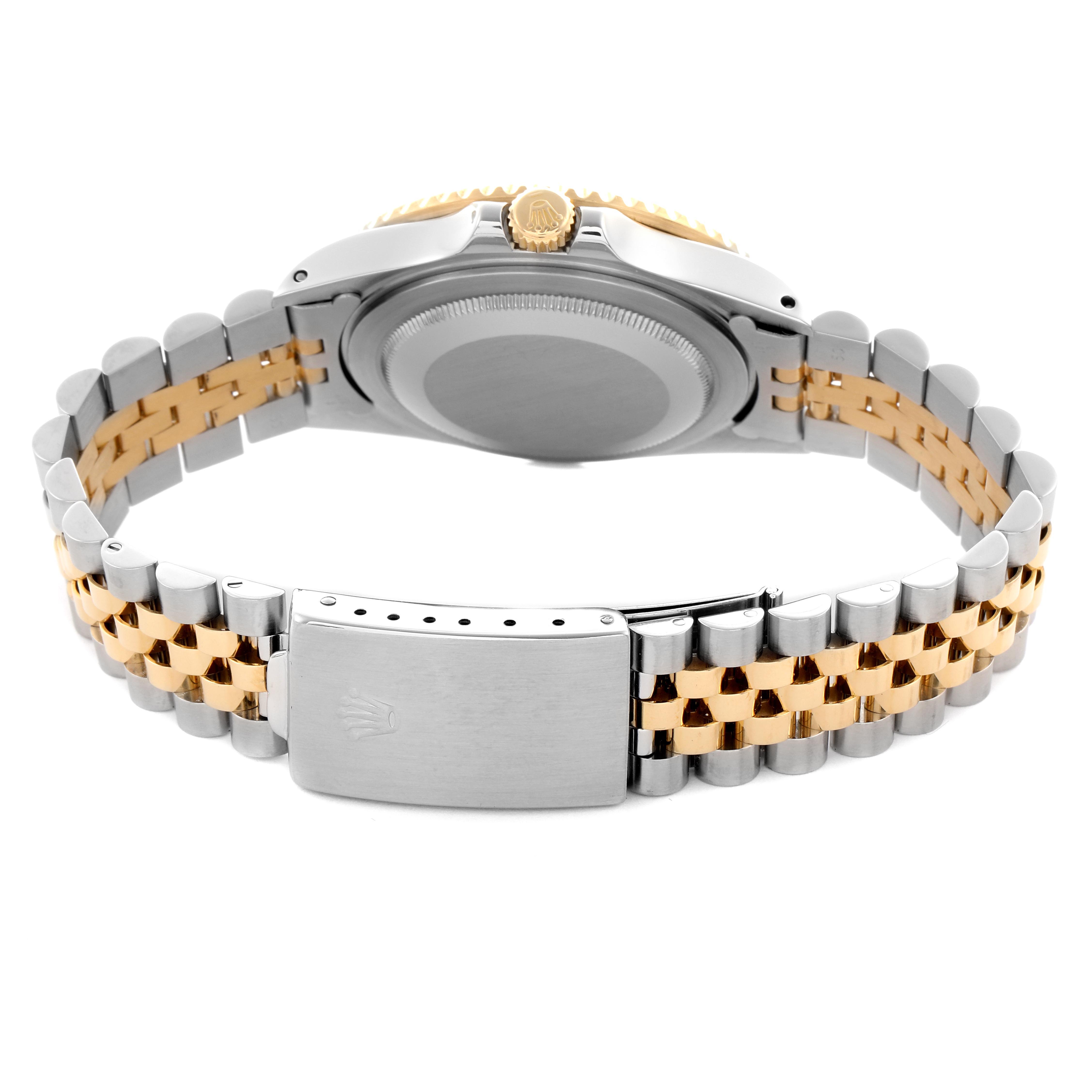 The image shows the back and bracelet of a Rolex GMT-Master 16713LN Men's Steel and Gold (two tone) Black Dial 16713LN Men's Steel and Gold (two tone) Black Dial watch, featuring a two-tone metal design and clasp.