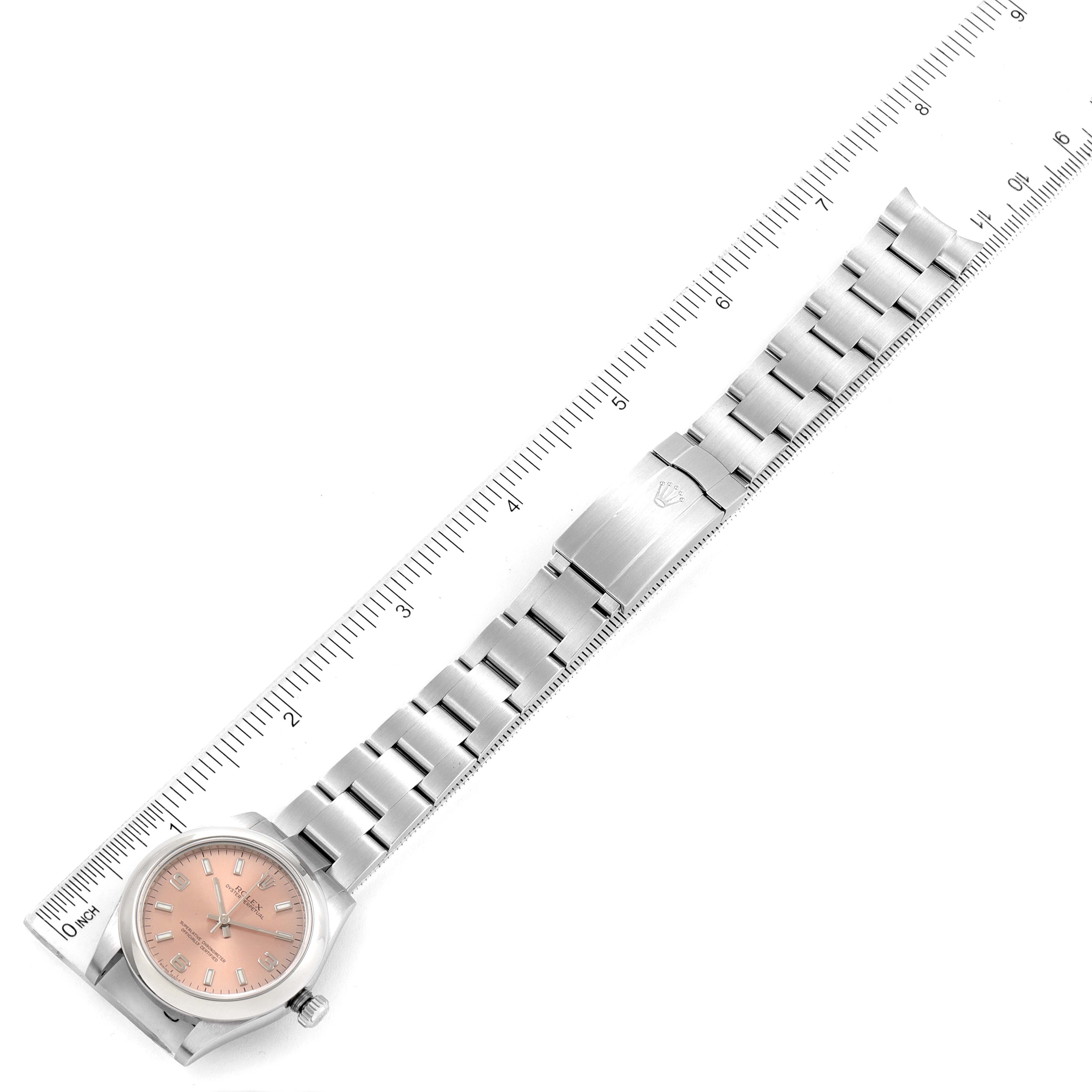 The Rolex Mid-Size 177200 Women's Stainless Steel Pink Dial 177200 Women's Stainless Steel Pink Dial watch is displayed flat, showing the full bracelet and face with a ruler for size reference.