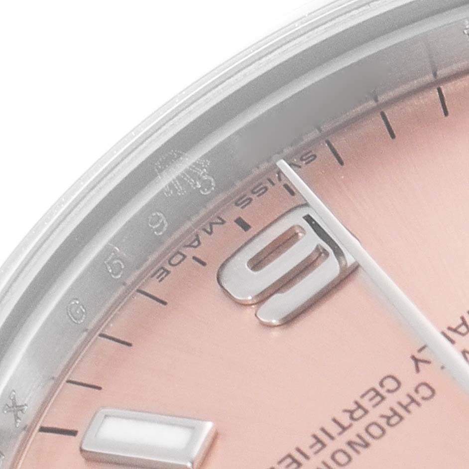The image shows a close-up of the 9 o'clock position on the dial of a Rolex Mid-Size 177200 Women's Stainless Steel Pink Dial 177200 Women's Stainless Steel Pink Dial watch, including the hour marker and part of the bezel.