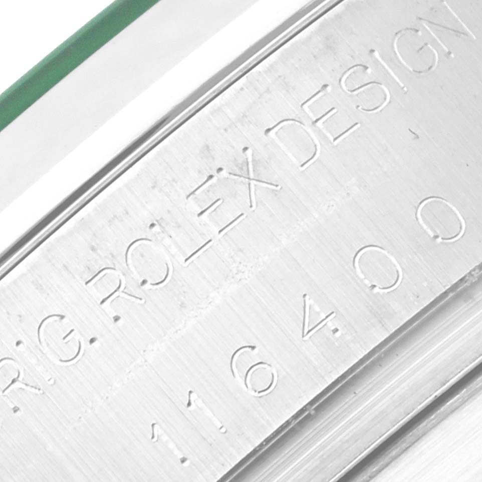 The image shows an engraved side view of the Milgauss model by Rolex, highlighting its model number and "ROLEX DESIGN."