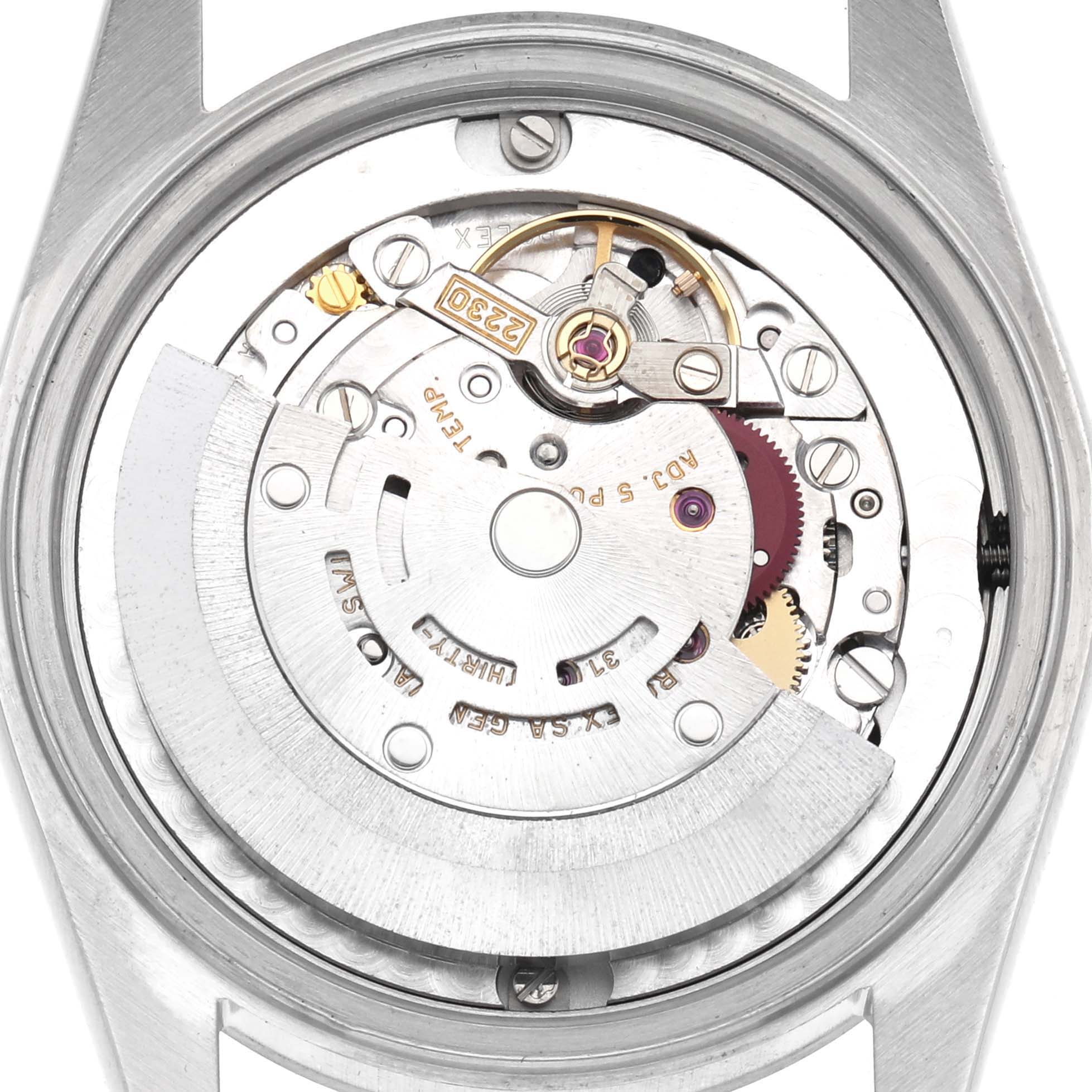 The image shows the movement and internal mechanics of a Rolex Mid-Size 77080 Women's Stainless Steel Black Dial 77080 Women's Stainless Steel Black Dial watch from a rear view.