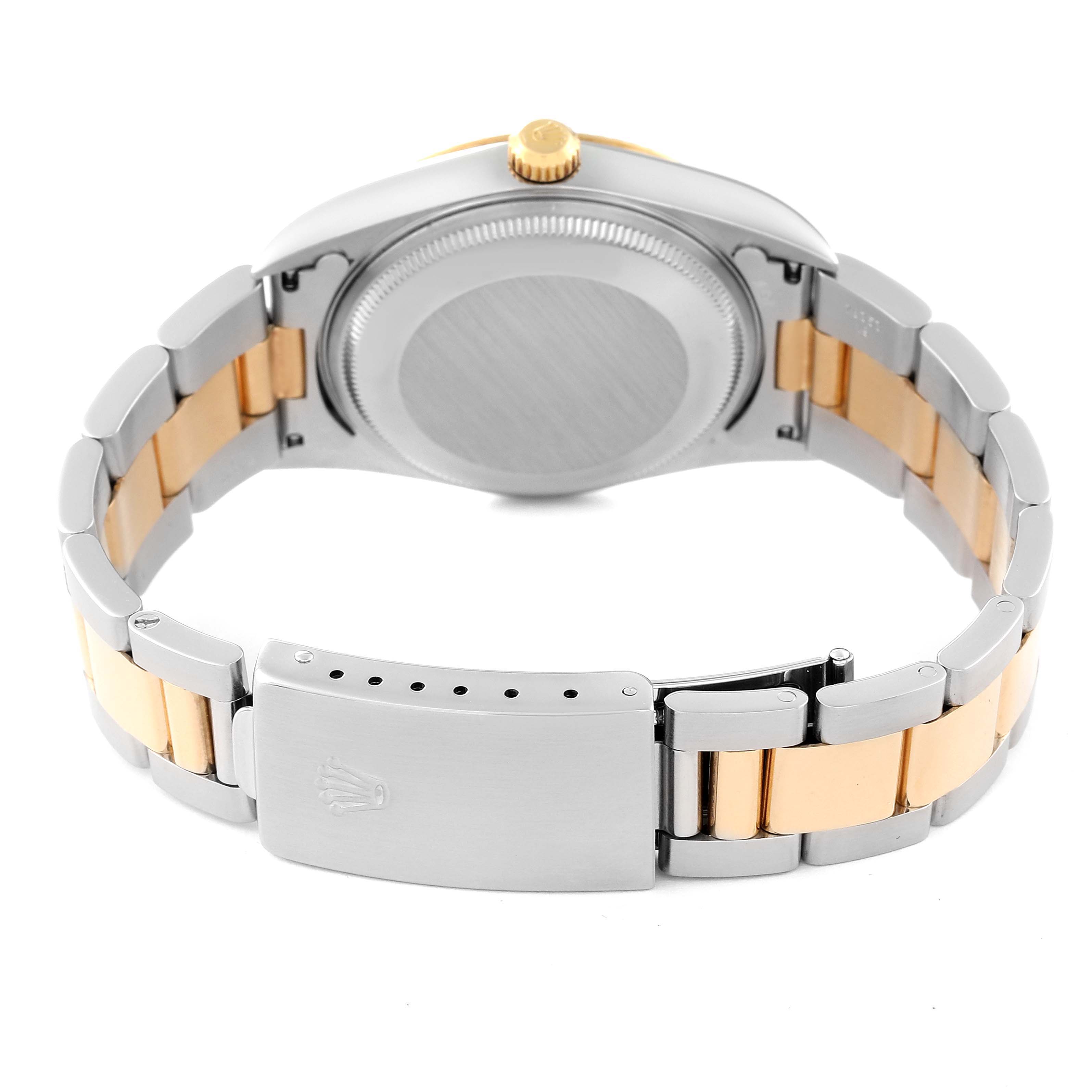 This image shows the back view of the Rolex Oyster Perpetual 14233 Men's Steel and Gold (two tone) Champagne Dial 14233 Men's Steel and Gold (two tone) Champagne Dial watch, featuring the case back and two-tone bracelet with the clasp displayed.