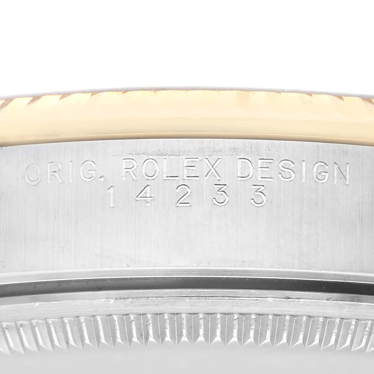 This side view image shows the case side and part of the fluted bezel, with "ORIG. ROLEX DESIGN 14233" engraved, of the Rolex Oyster Perpetual 14233 Men's Steel and Gold (two tone) Champagne Dial 14233 Men's Steel and Gold (two tone) Champagne Dial watch.