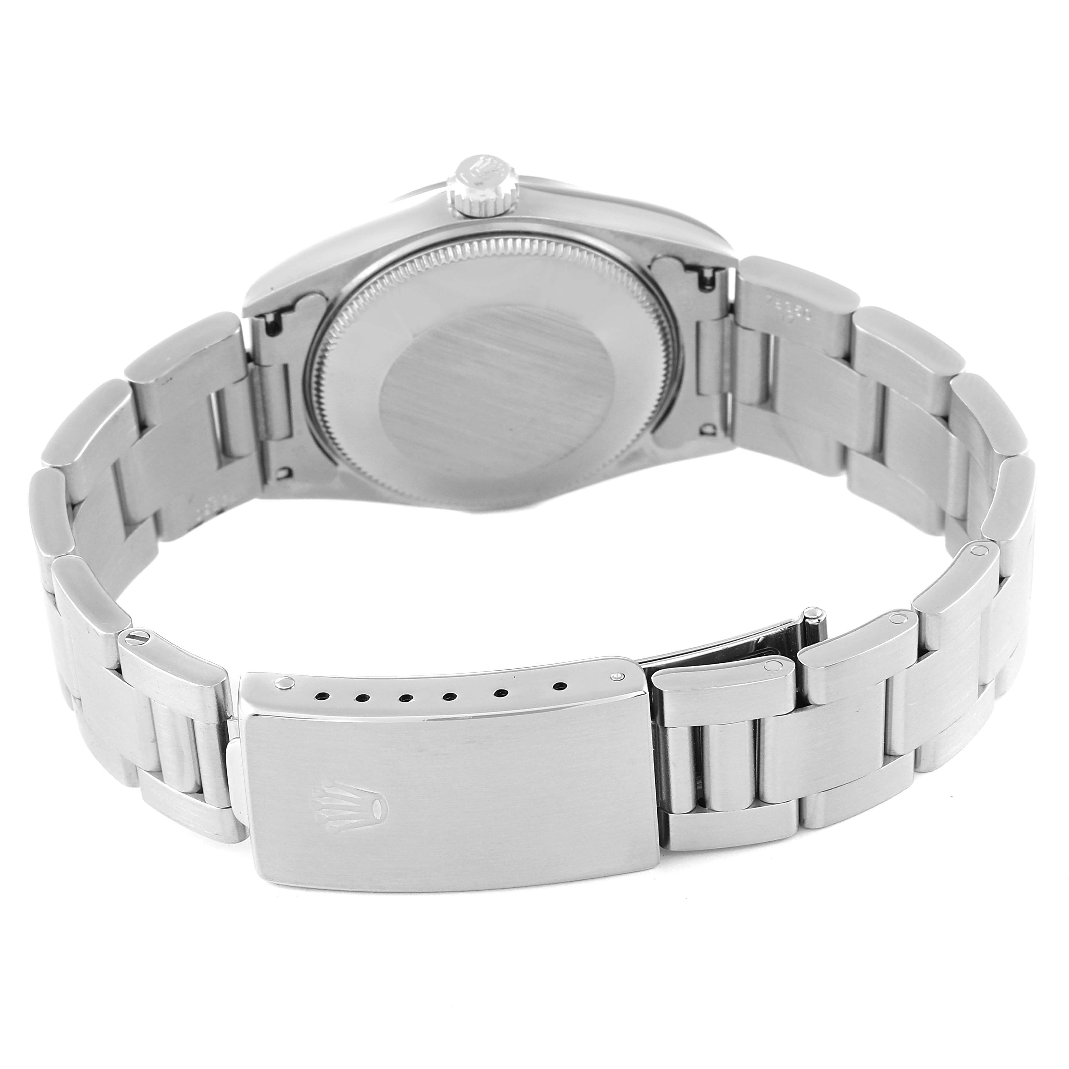 The image shows the back and bracelet of a Rolex Mid-Size 67480 Women
s Stainless Steel Pink Dial 67480 Women
s Stainless Steel Pink Dial model watch, highlighting the clasp and case back.