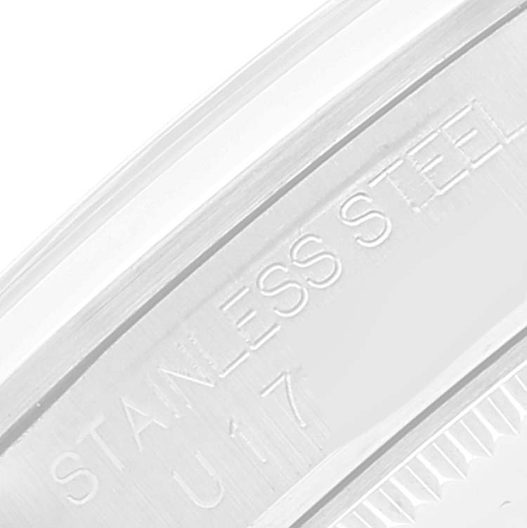 This close-up image shows the side engraving of a Mid-Size Rolex watch, featuring "STAINLESS STEEL" text.
