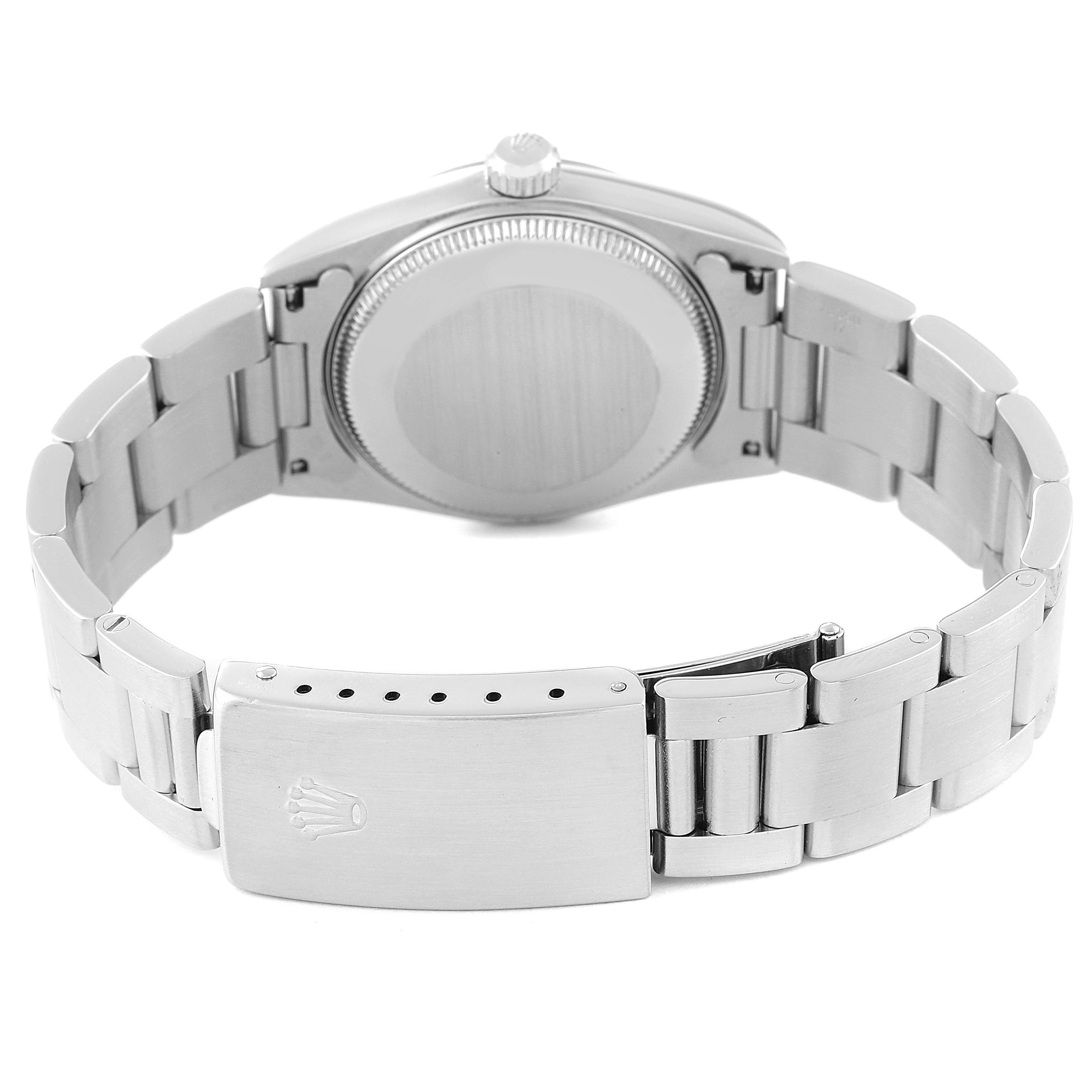 The image shows the back of a Mid-Size Rolex watch, displaying its closed case back, bracelet, and clasp with the Rolex logo.