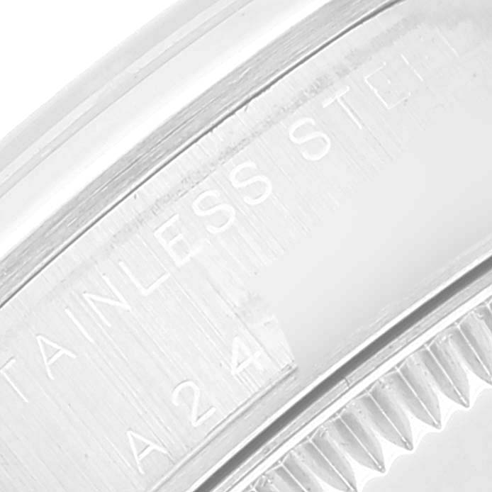 This image shows a close-up of the case back with part of the engravings on a Mid-Size Rolex watch.
