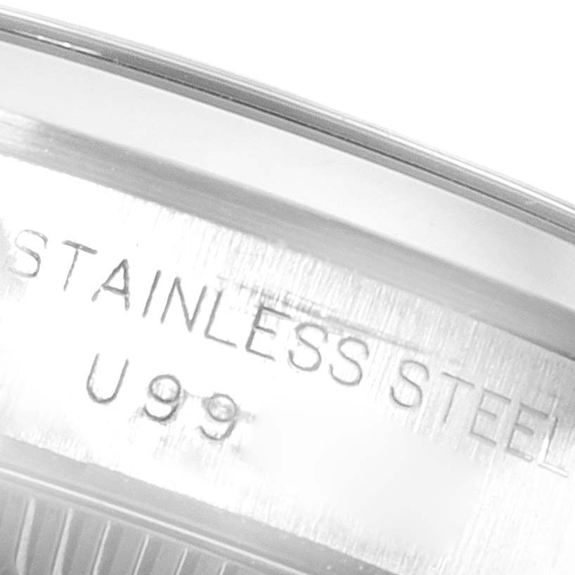 The image shows a close-up of the stainless steel casing of a Rolex Oyster Perpetual 67180 Women's Stainless Steel Black Dial 67180 Women's Stainless Steel Black Dial watch.