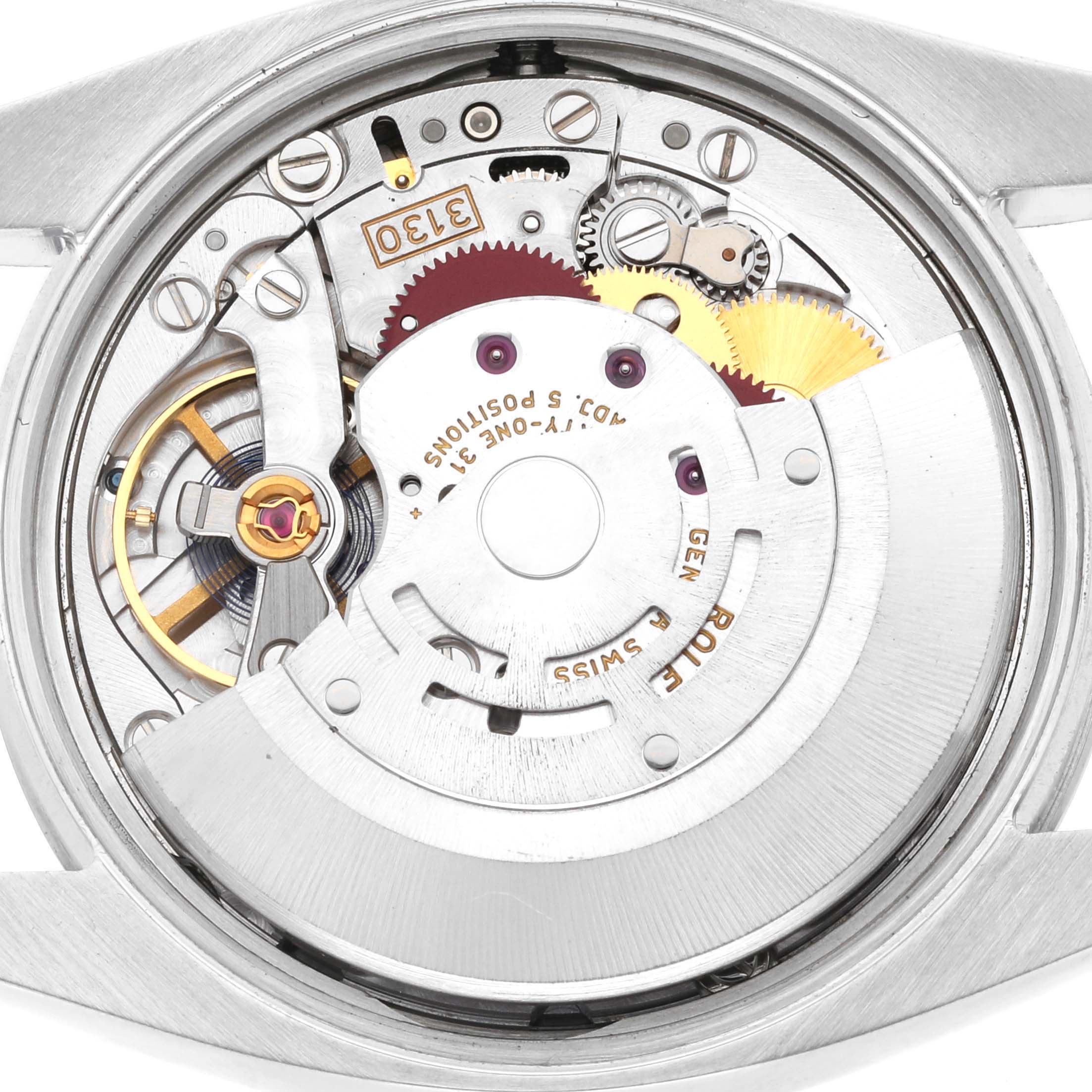 This is a close-up view of the internal mechanical movement of a Rolex Oyster Perpetual 114200 Men
s Stainless Steel Green Dial 114200 Men
s Stainless Steel Green Dial watch.