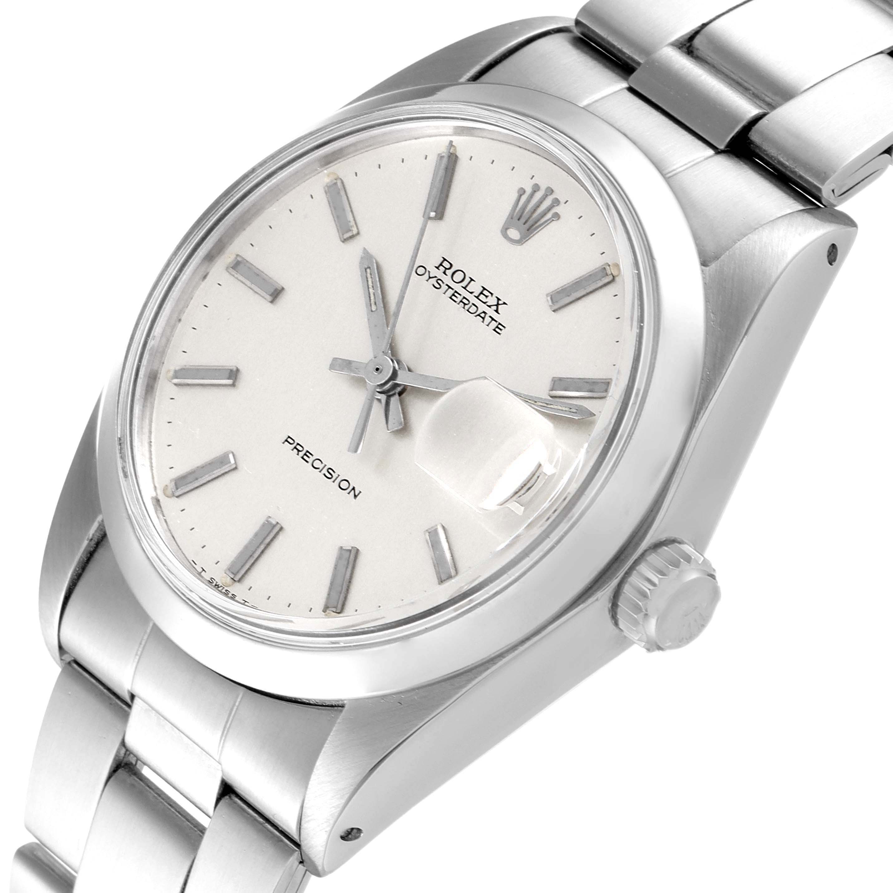 The image shows a Rolex Oysterdate Precision watch at a slight angle, highlighting its dial, bezel, crown, and bracelet.