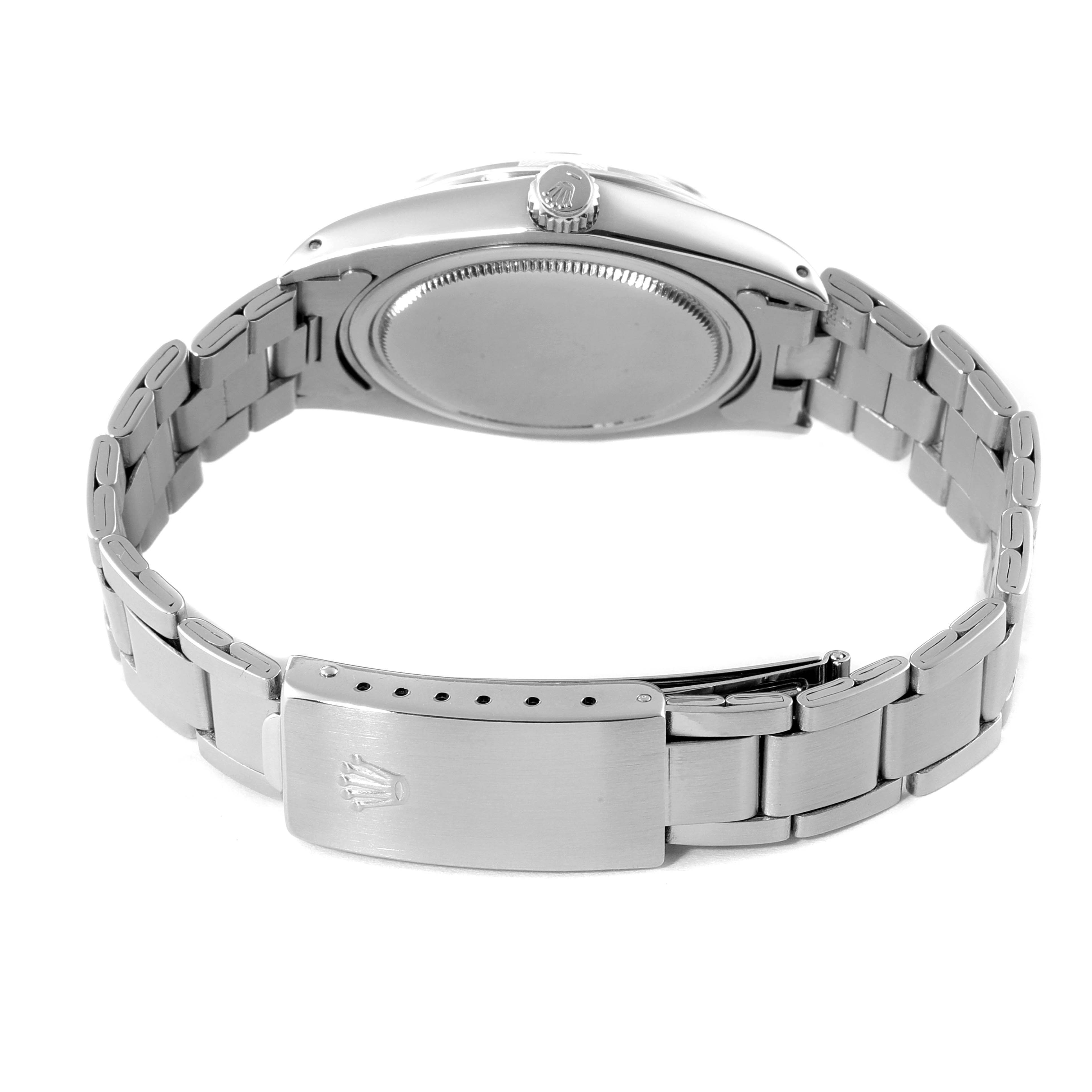 The image shows the back view of a Rolex Date 6694 Men's Stainless Steel Silver Dial 6694 Men's Stainless Steel Silver Dial model watch, featuring the case back, crown, and bracelet with the clasp.