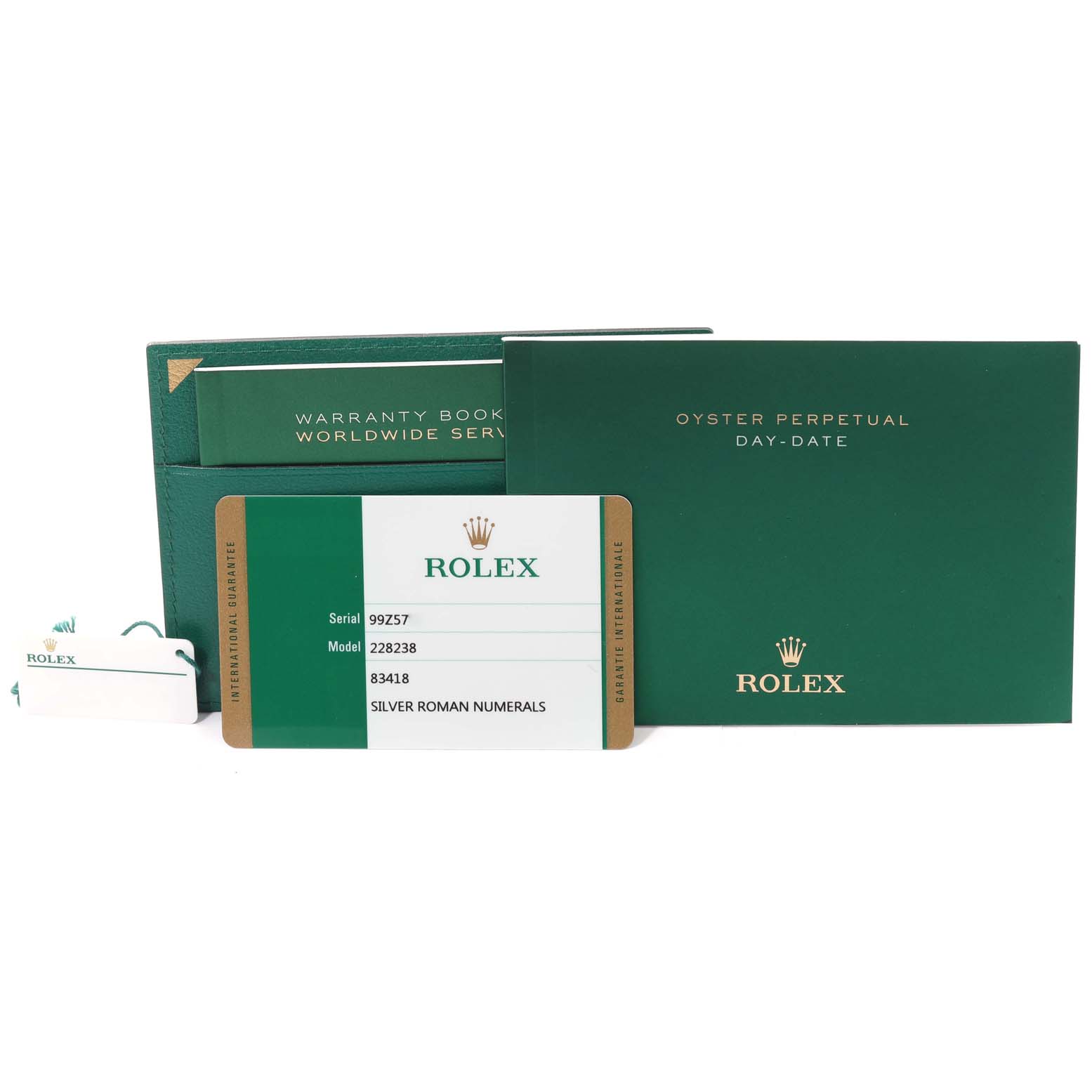 The image shows the warranty book, oyster perpetual day-date manual, tag, and guarantee card for a Rolex President 228238 Men
s Yellow Gold Silver Dial 228238 Men
s Yellow Gold Silver Dial model watch.
