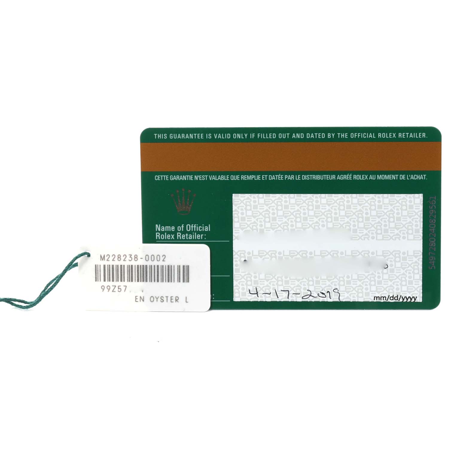 The image shows the guarantee card for the Rolex President 228238 Men
s Yellow Gold Silver Dial 228238 Men
s Yellow Gold Silver Dial model with the serial number tag attached.