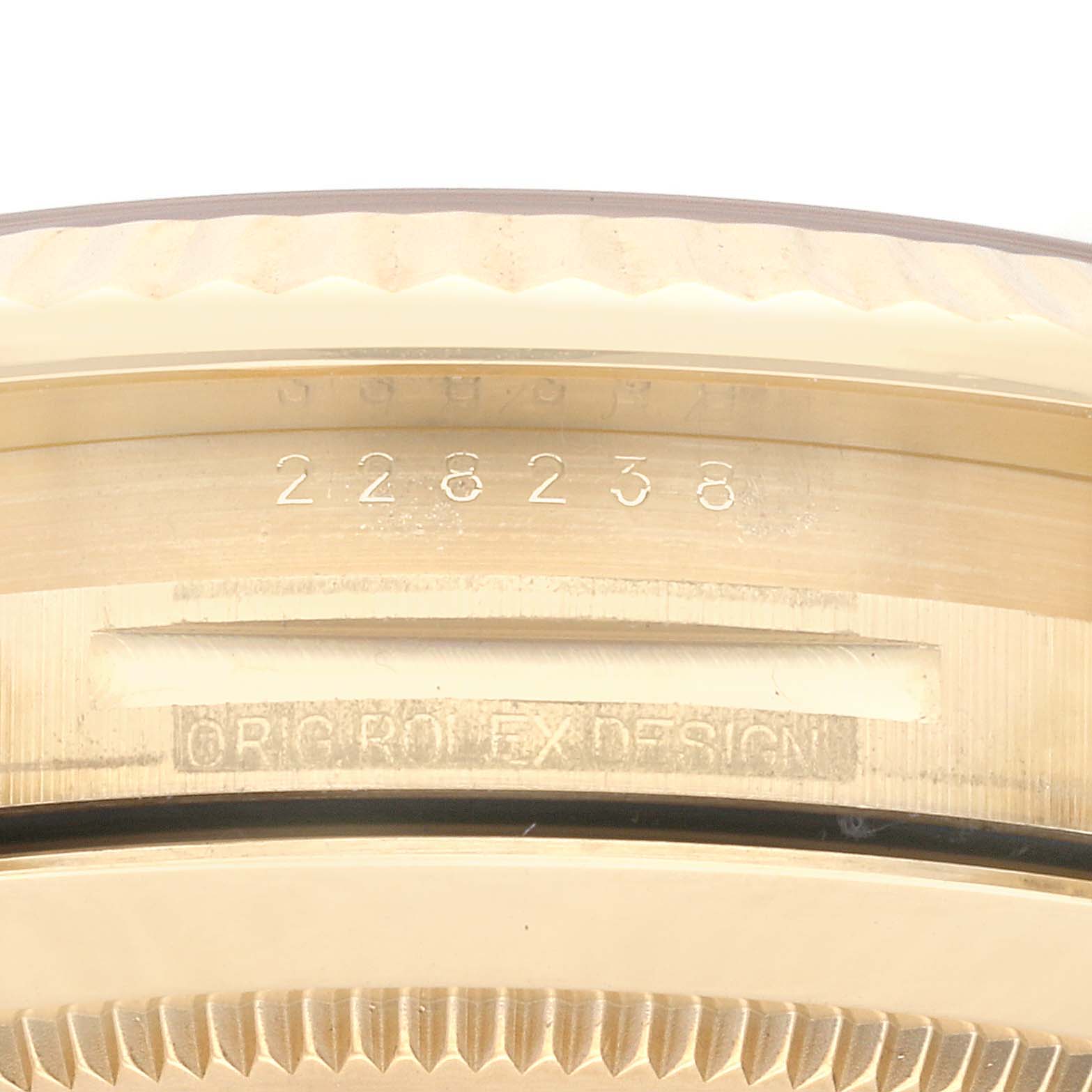 This close-up image shows the inside case and serial number of a Rolex President 228238 Men
s Yellow Gold Silver Dial 228238 Men
s Yellow Gold Silver Dial model watch.