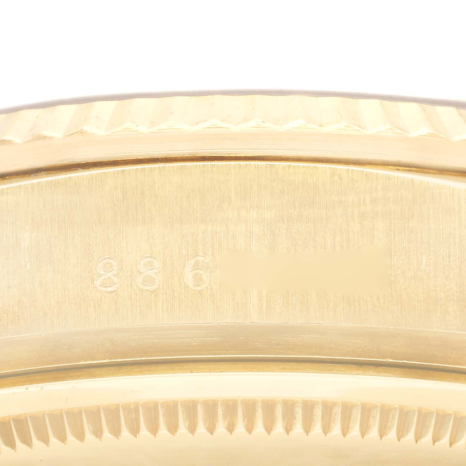 The image shows a close-up of the serial number engraved on the case of a Rolex President 18038 Men's Yellow Gold Champagne Dial 18038 Men's Yellow Gold Champagne Dial model watch.