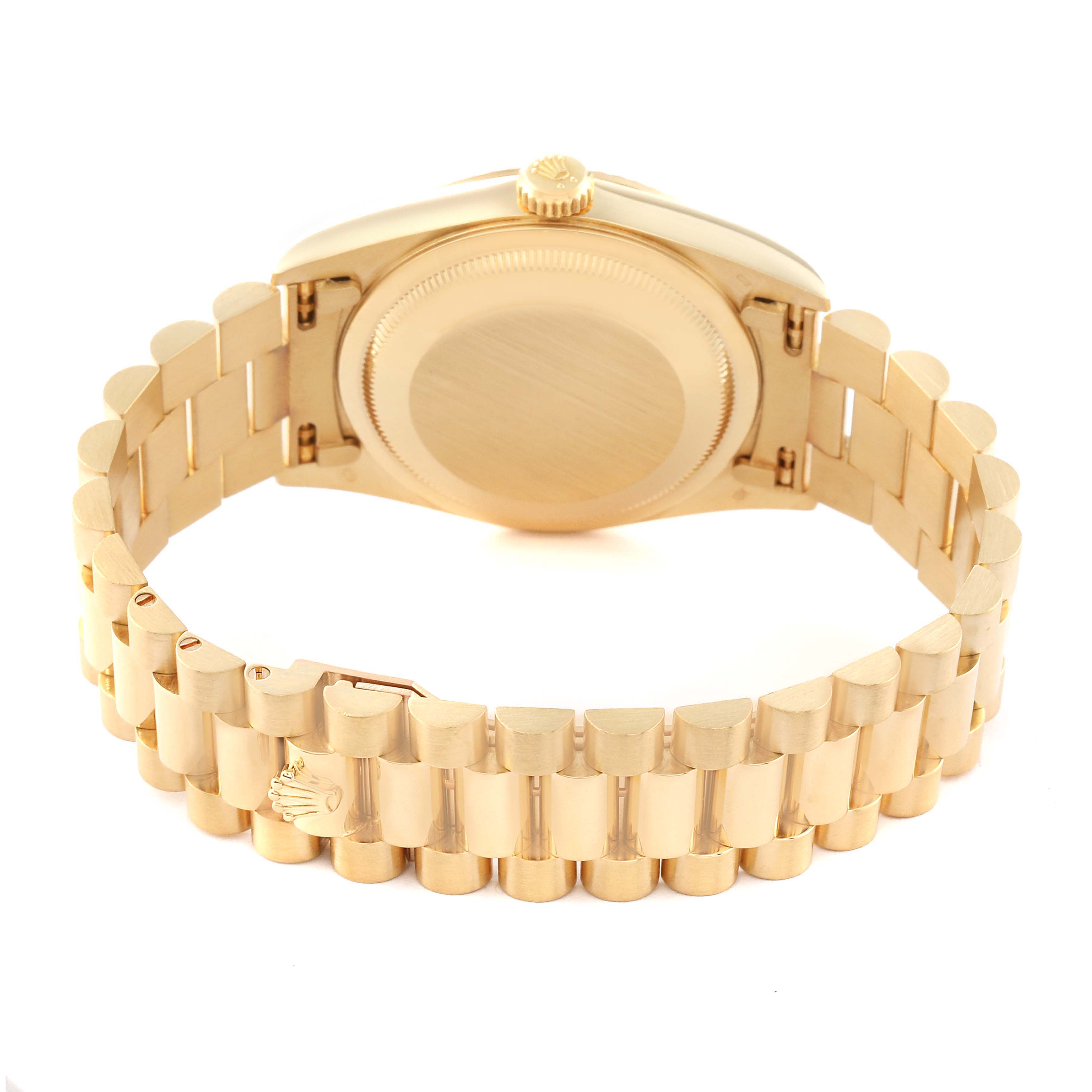 This image shows the back side of the Rolex President 18238 Men
s Yellow Gold Champagne Dial 18238 Men
s Yellow Gold Champagne Dial model watch, highlighting the case back and gold bracelet.