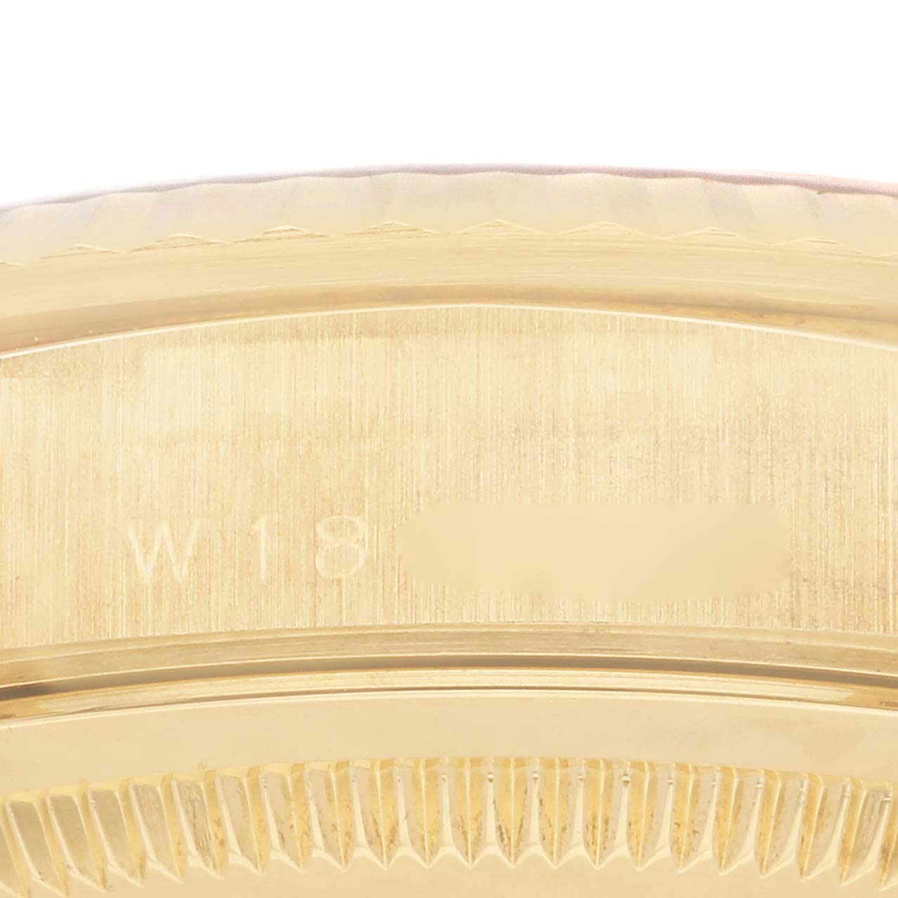 The image shows a close-up of the reference number area on the gold case side of a Rolex President 18238 Men
s Yellow Gold Champagne Dial 18238 Men
s Yellow Gold Champagne Dial model watch.