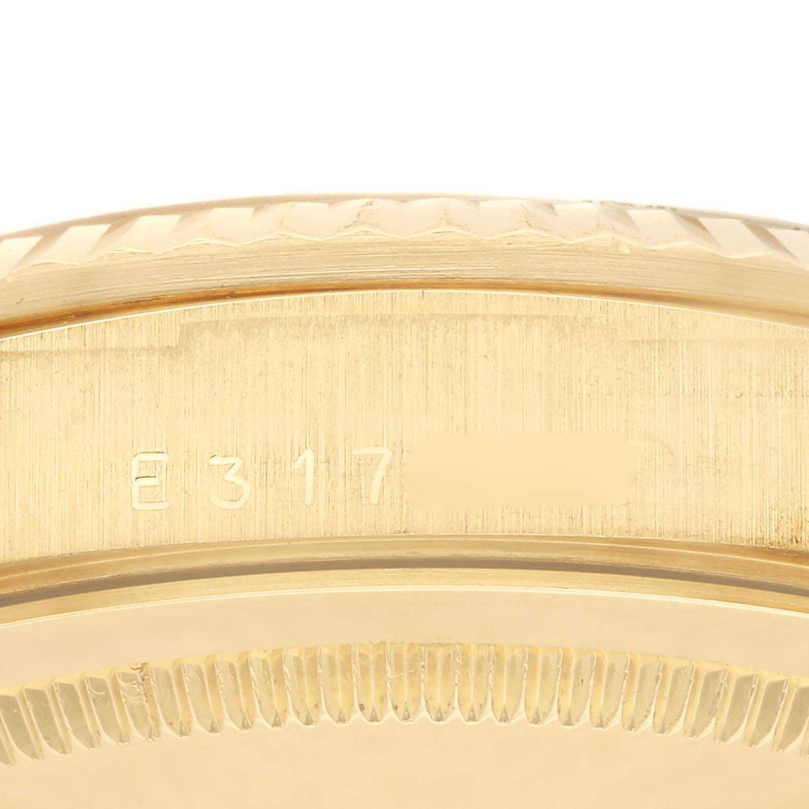 The image shows a close-up of the side and outer edge of the case of the Rolex President 18238 Men
s Yellow Gold Champagne Dial 18238 Men
s Yellow Gold Champagne Dial model, displaying part of the serial number engraving.