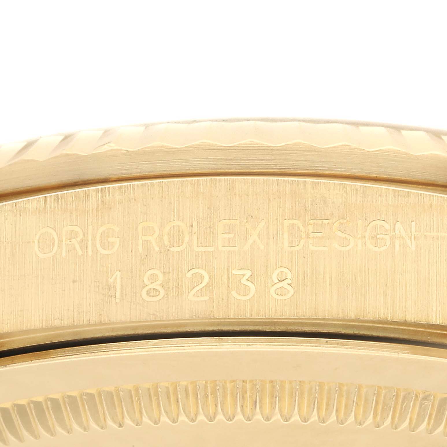 This image shows a close-up of the engraved model number on the case side of a Rolex President 18238 Men
s Yellow Gold Champagne Dial 18238 Men
s Yellow Gold Champagne Dial model watch.