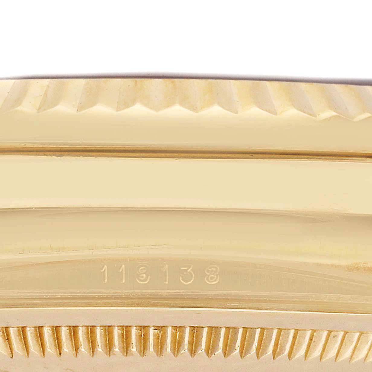 The image shows a close-up side view of the bezel and case of a Rolex President 118138 Men's Yellow Gold Green Dial model watch, highlighting its gold finish and reference number.