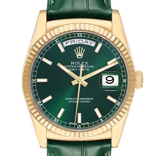 The Rolex President 118138 Men's Yellow Gold Green Dial model is shown from a front angle, displaying its green dial, day and date features, fluted bezel, and gold case.