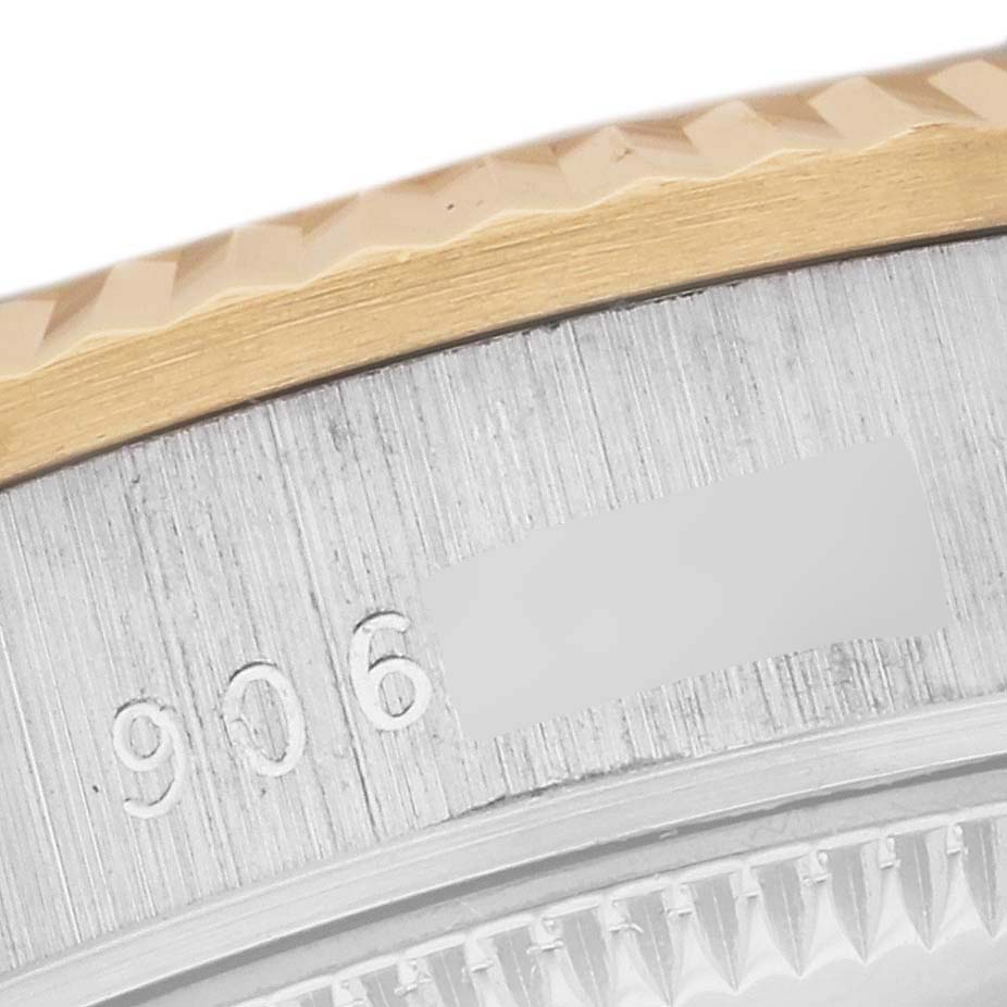 This close-up image shows the fluted bezel and part of the case with etched serial numbers on a Rolex President 68279 Women's White Gold Silver Dial 68279 Women's White Gold Silver Dial watch.