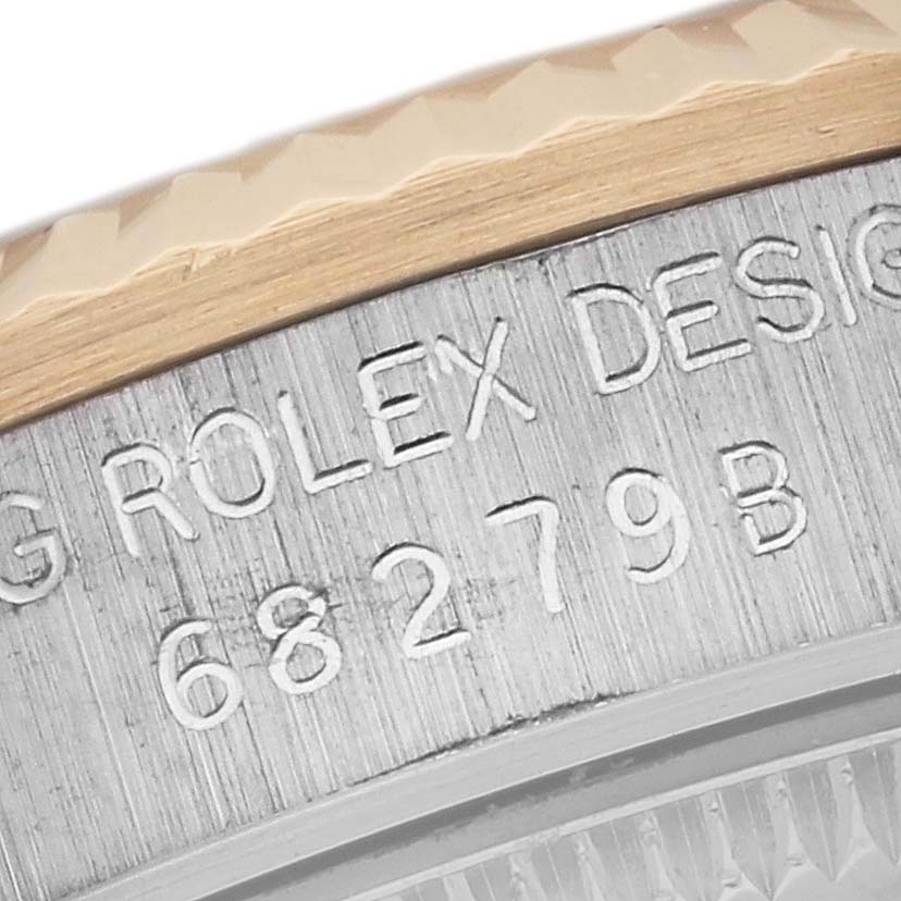 The image shows a close-up of the case and bezel of a Rolex President 68279 Women's White Gold Silver Dial 68279 Women's White Gold Silver Dial model watch with its serial number.