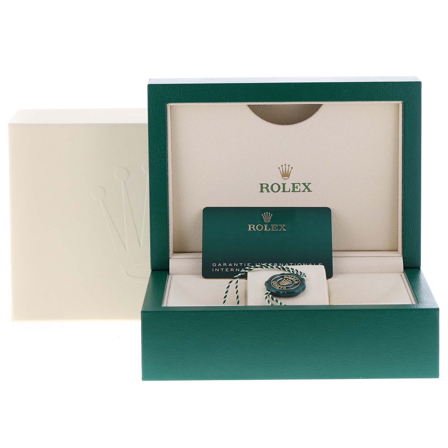 This image shows the packaging and accessories of a Rolex Submariner 126613 Men's Steel and Gold (two tone) Blue Dial 126613 Men's Steel and Gold (two tone) Blue Dial including the box, guarantee card, and medallion.