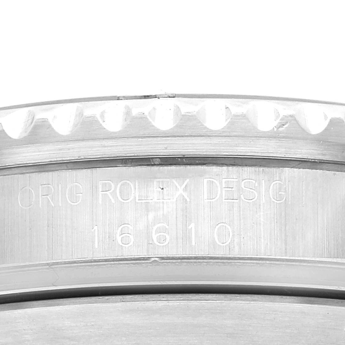 This close-up image shows the side engraving of the bezel and case of a Rolex Submariner 16610 Men
s Stainless Steel Black Dial 16610 Men
s Stainless Steel Black Dial model 16610 watch.