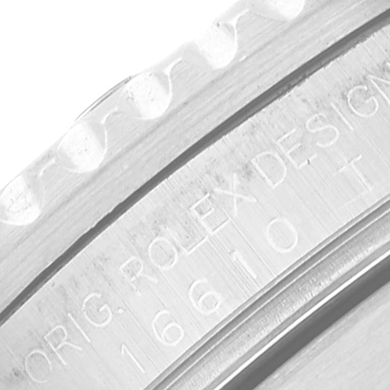 The image shows a close-up of the engraved inner bezel of a Rolex Submariner 16610 Men's Stainless Steel Black Dial 16610 Men's Stainless Steel Black Dial watch.