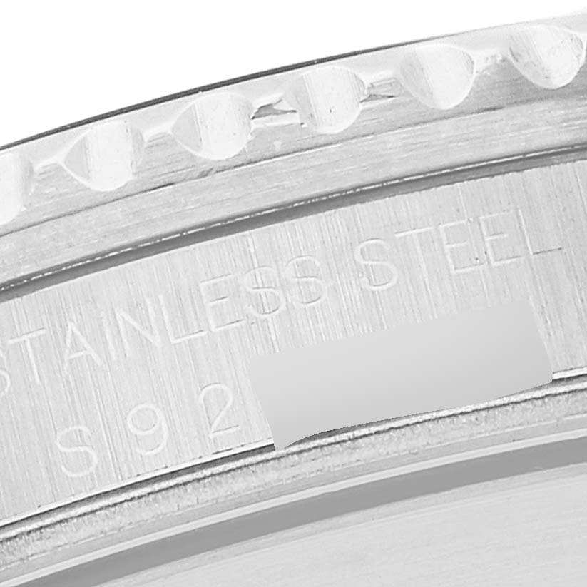 This image shows a close-up view of the stainless steel bezel and engraved serial number of a Rolex Submariner 16610 Men
s Stainless Steel Black Dial 16610 Men
s Stainless Steel Black Dial watch.