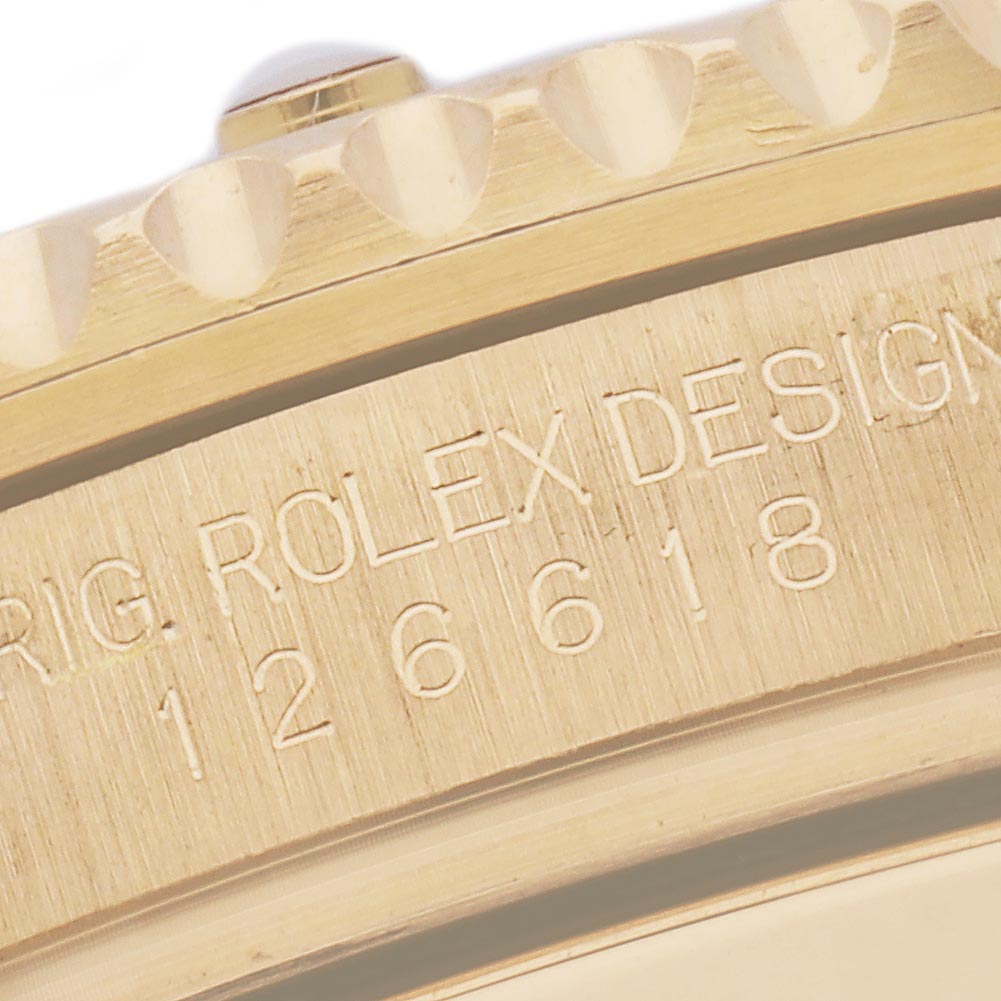 The image shows a close-up of the edge and reference number engraving on a Rolex Submariner 126618LB Men's Yellow Gold Blue Dial 126618LB Men's Yellow Gold Blue Dial watch case.