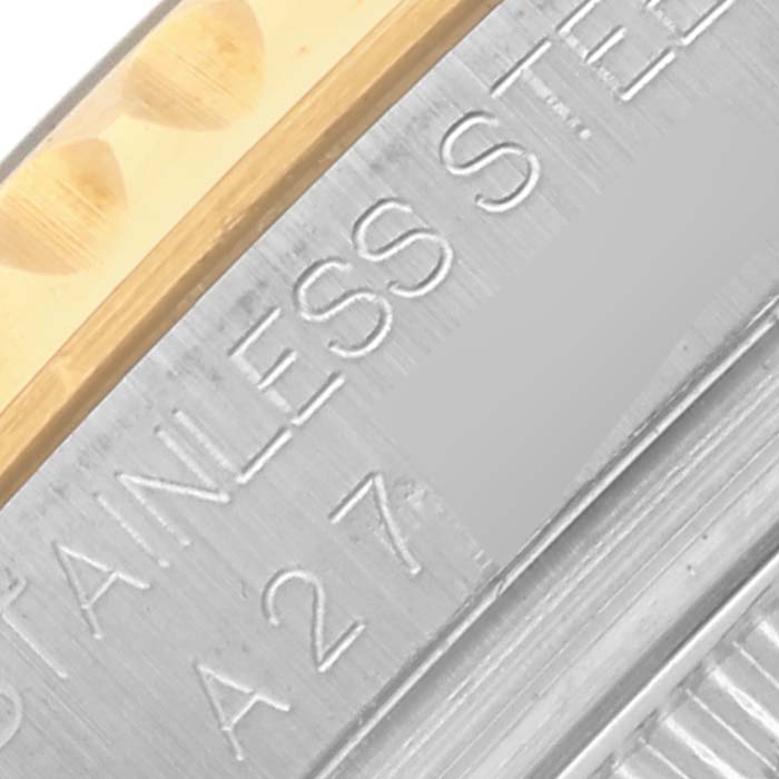 The image shows a close-up of the edge and engraved side of a Rolex Yacht-Master 68623 Men's Steel and Gold (two tone) Blue Dial 68623 Men's Steel and Gold (two tone) Blue Dial watch case or bezel.