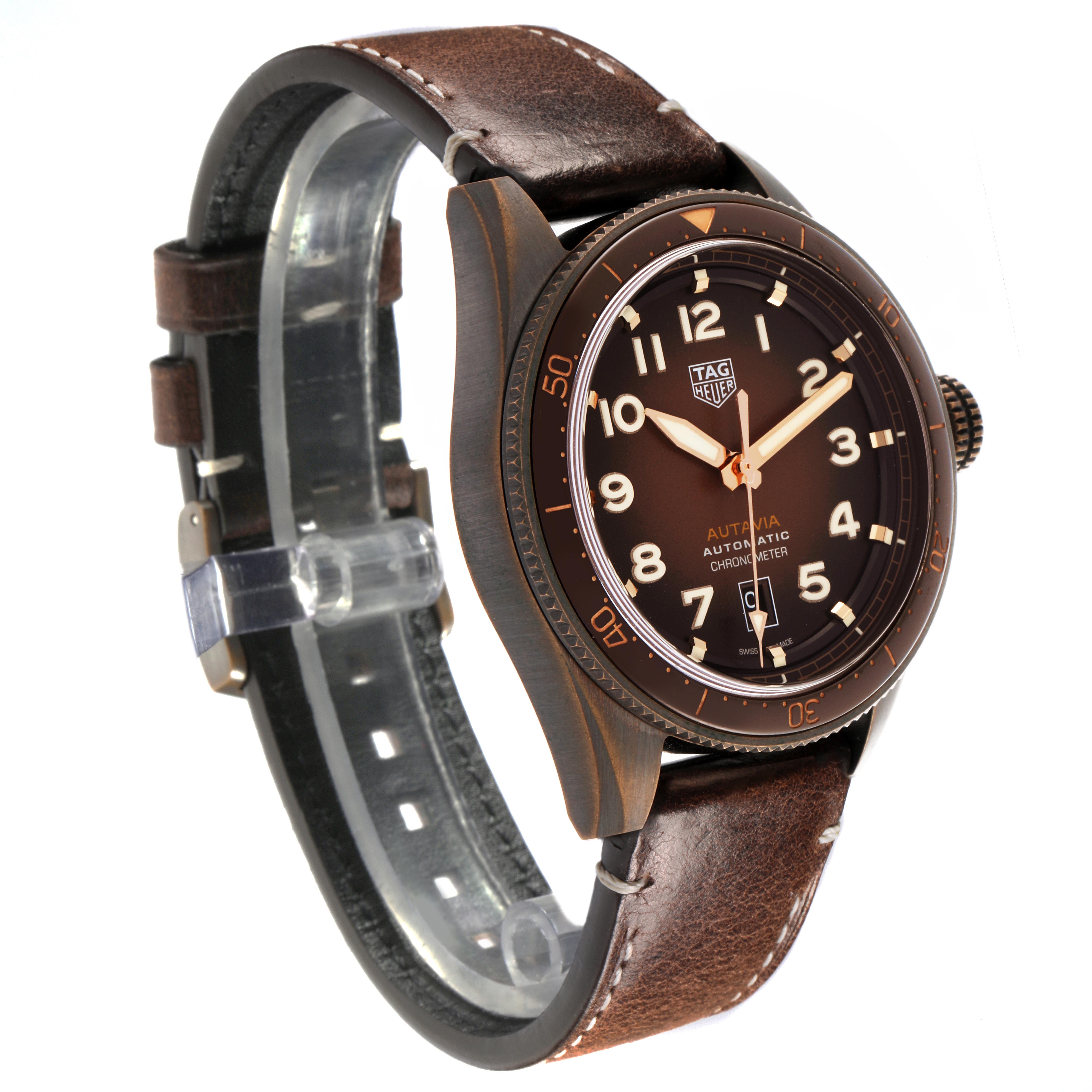 The Tag Heuer Autavia WBE5191.FC8276 Men's Bronze Brown Dial WBE5191.FC8276 Men's Bronze Brown Dial watch is shown at a three-quarter angle with its brown dial, bezel, and leather strap visible.