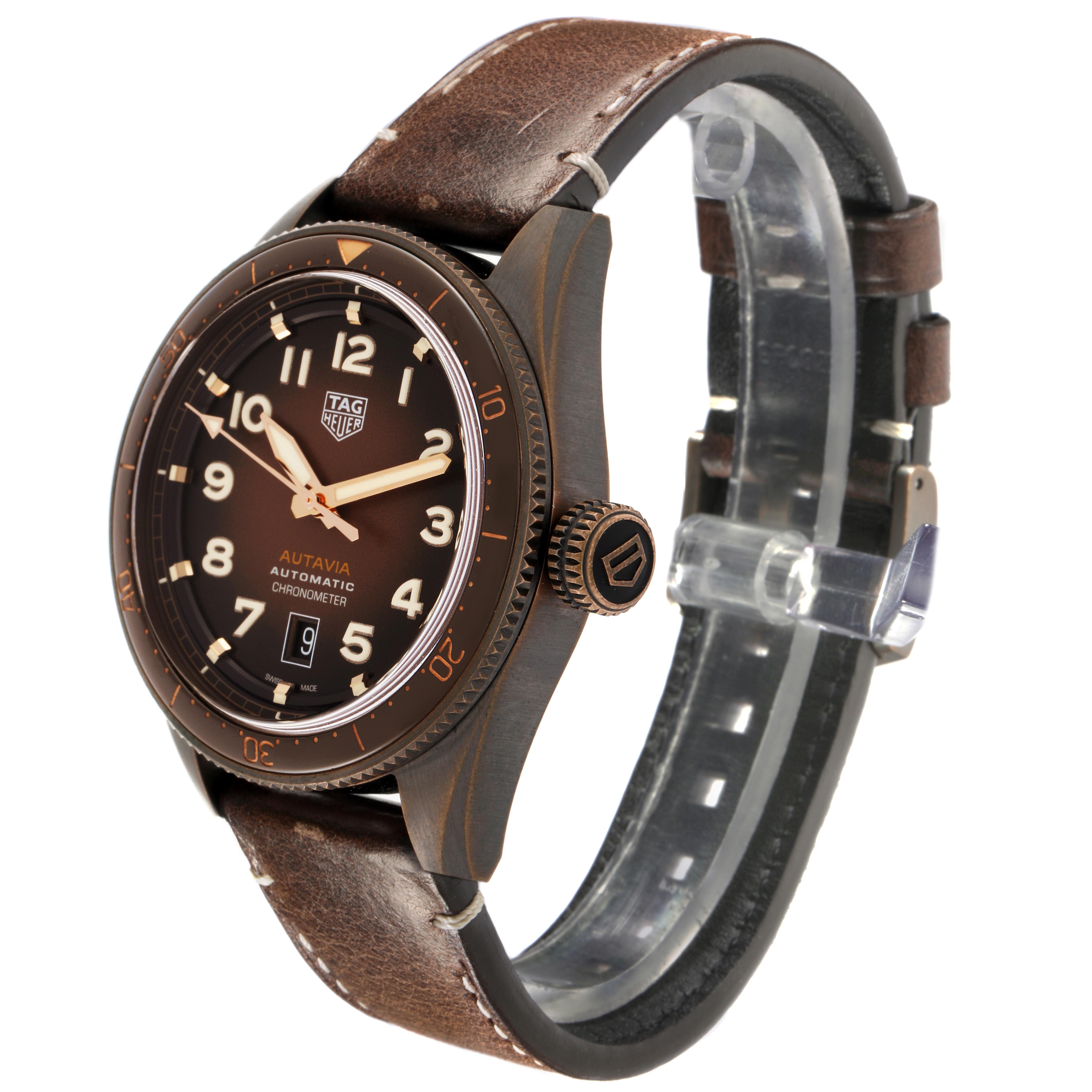 The Tag Heuer Autavia WBE5191.FC8276 Men's Bronze Brown Dial WBE5191.FC8276 Men's Bronze Brown Dial watch is shown at an angled side view, displaying the face, bezel, crown, and leather strap.