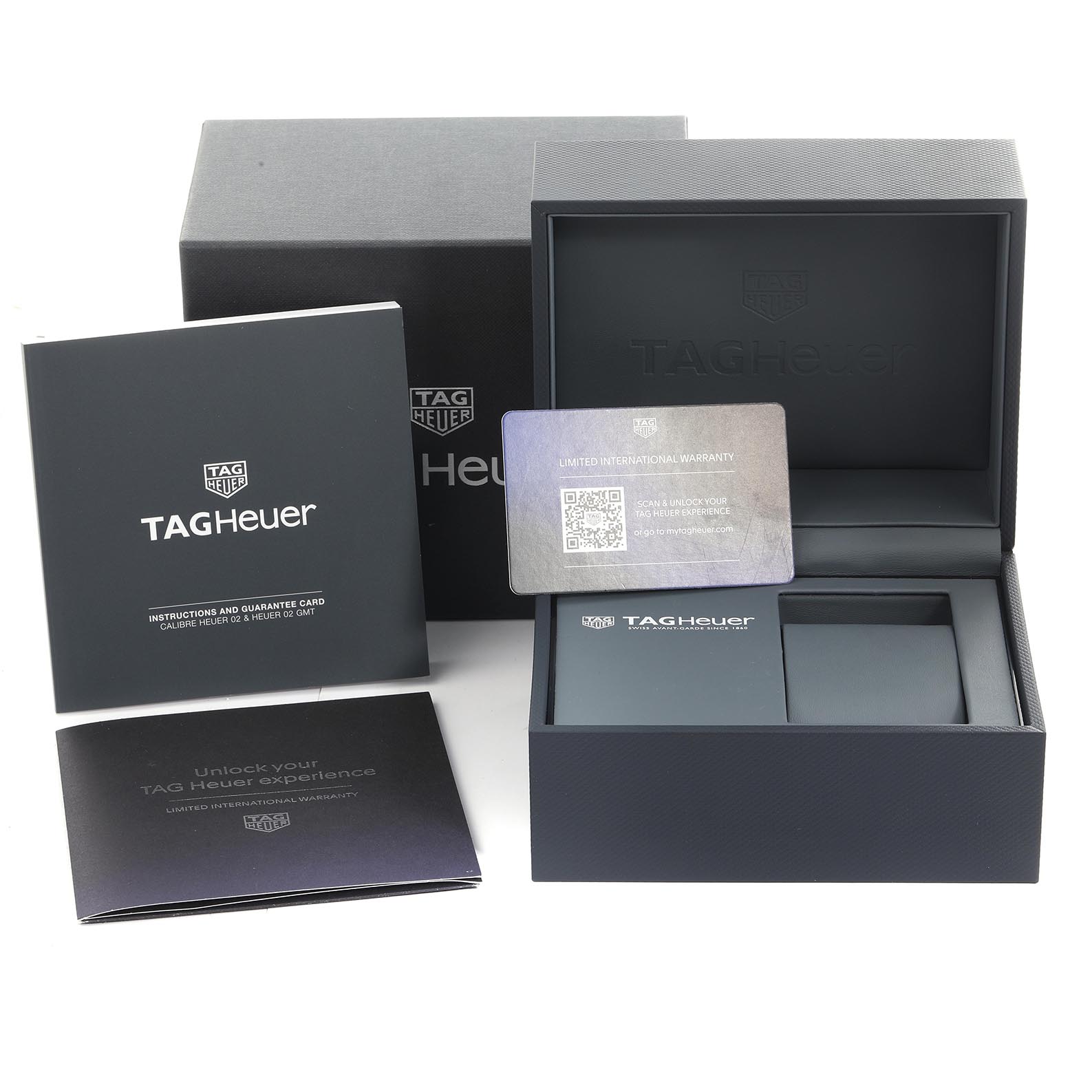 The image shows the packaging and accessories for a Tag Heuer Carrera CBN2013-0 Men's Stainless Steel Silver Dial CBN2013-0 Men's Stainless Steel Silver Dial watch, including boxes, manuals, and a warranty card.