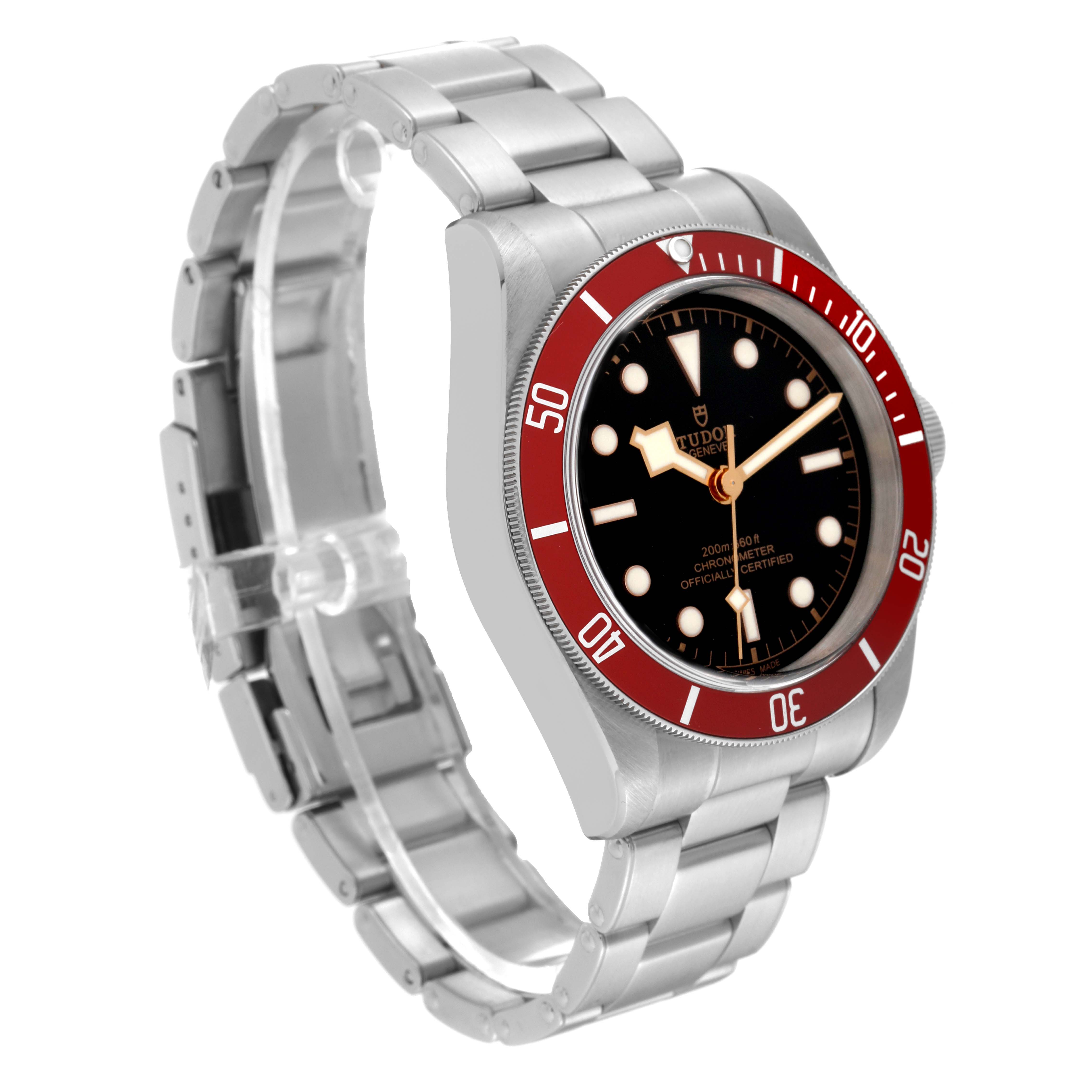 The image shows a Tudor Heritage Black Bay 79230R Men's Stainless Steel Black Dial 79230R Men's Stainless Steel Black Dial watch at a slight left-side angle, highlighting its face, red bezel, and stainless steel bracelet.