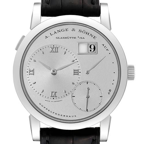 The image shows a frontal view of the Lange 1 model by A. Lange & Söhne, highlighting the dial, sub-dials, date display, and crown.