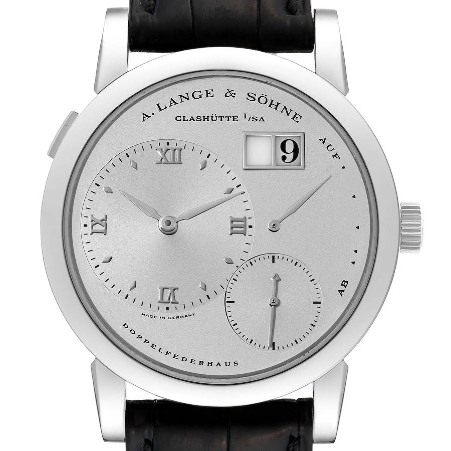 The image shows a frontal view of a Lange 1 watch by A. Lange & Söhne, highlighting its dials and date window.