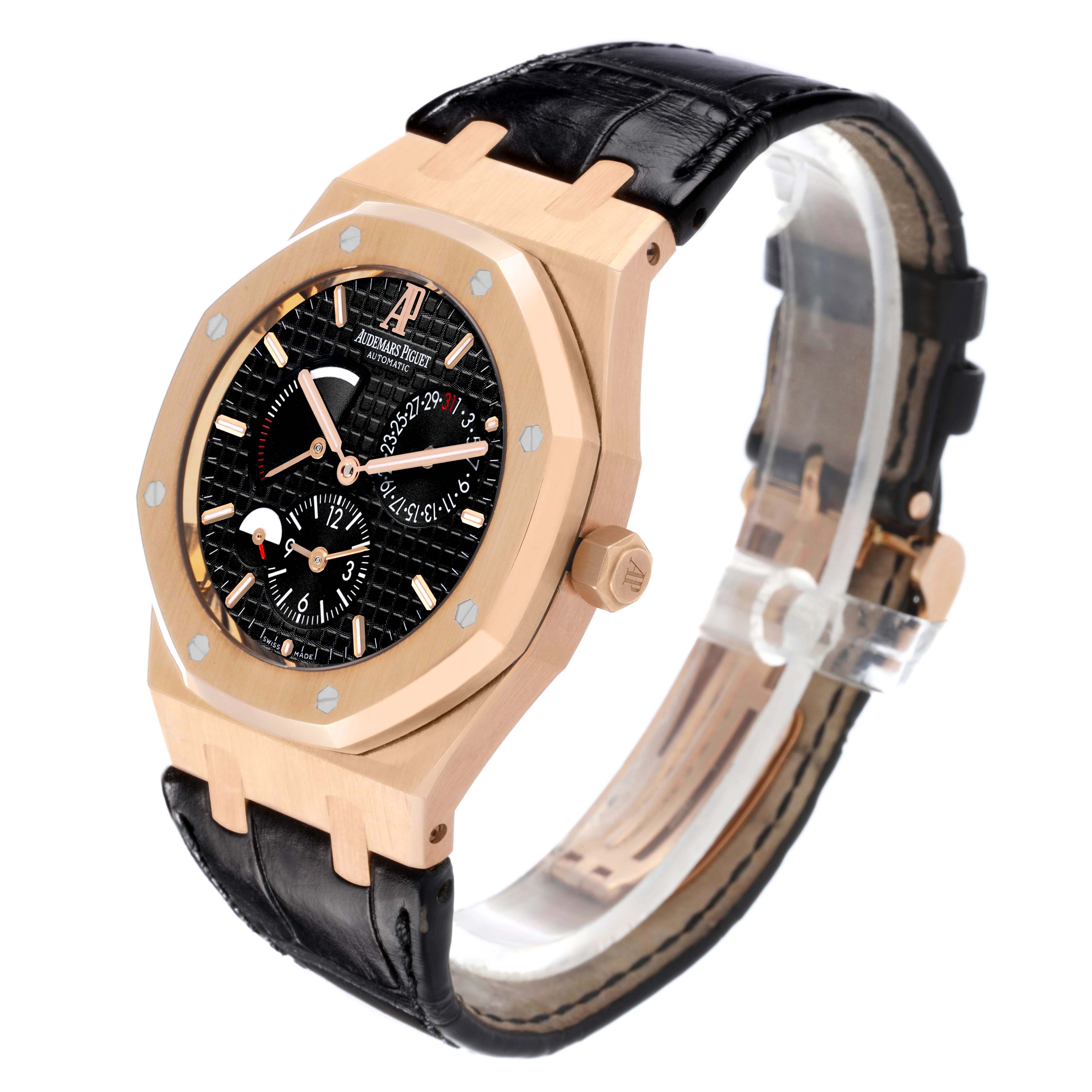The Audemars Piguet Royal Oak 26120OR.OO.D088CR.01 Men's Rose Gold Black Dial 26120OR.OO.D088CR.01 Men's Rose Gold Black Dial watch is shown at a three-quarter angle, highlighting the dial, case, crown, and strap.